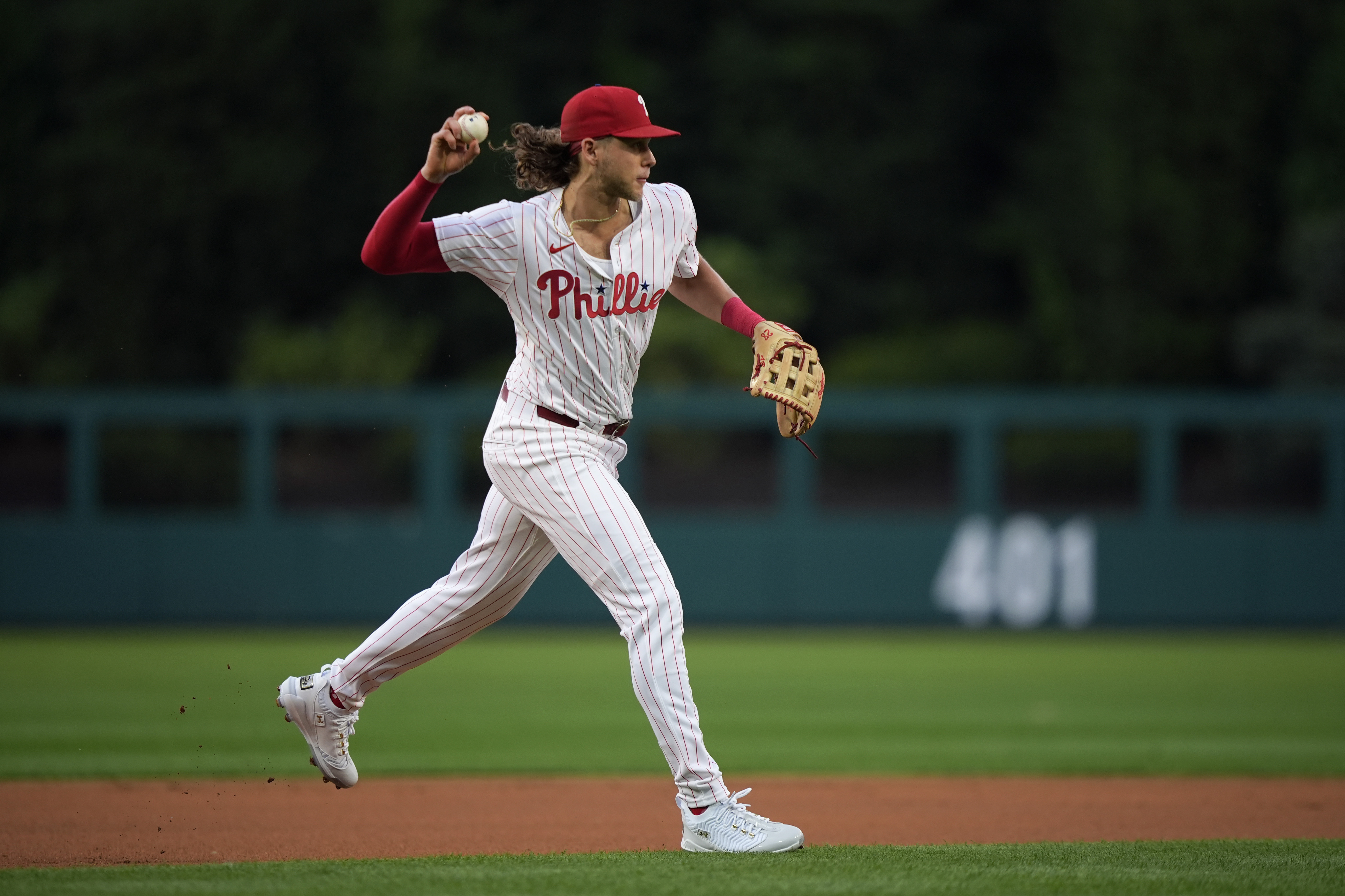 Philadelphia Phillies third base Alec Bohm throws to first after fielding a ground out by Houston Astros' Jeremy Peña during the first inning of a baseball game, Monday, Aug. 26, 2024, in Philadelphia.