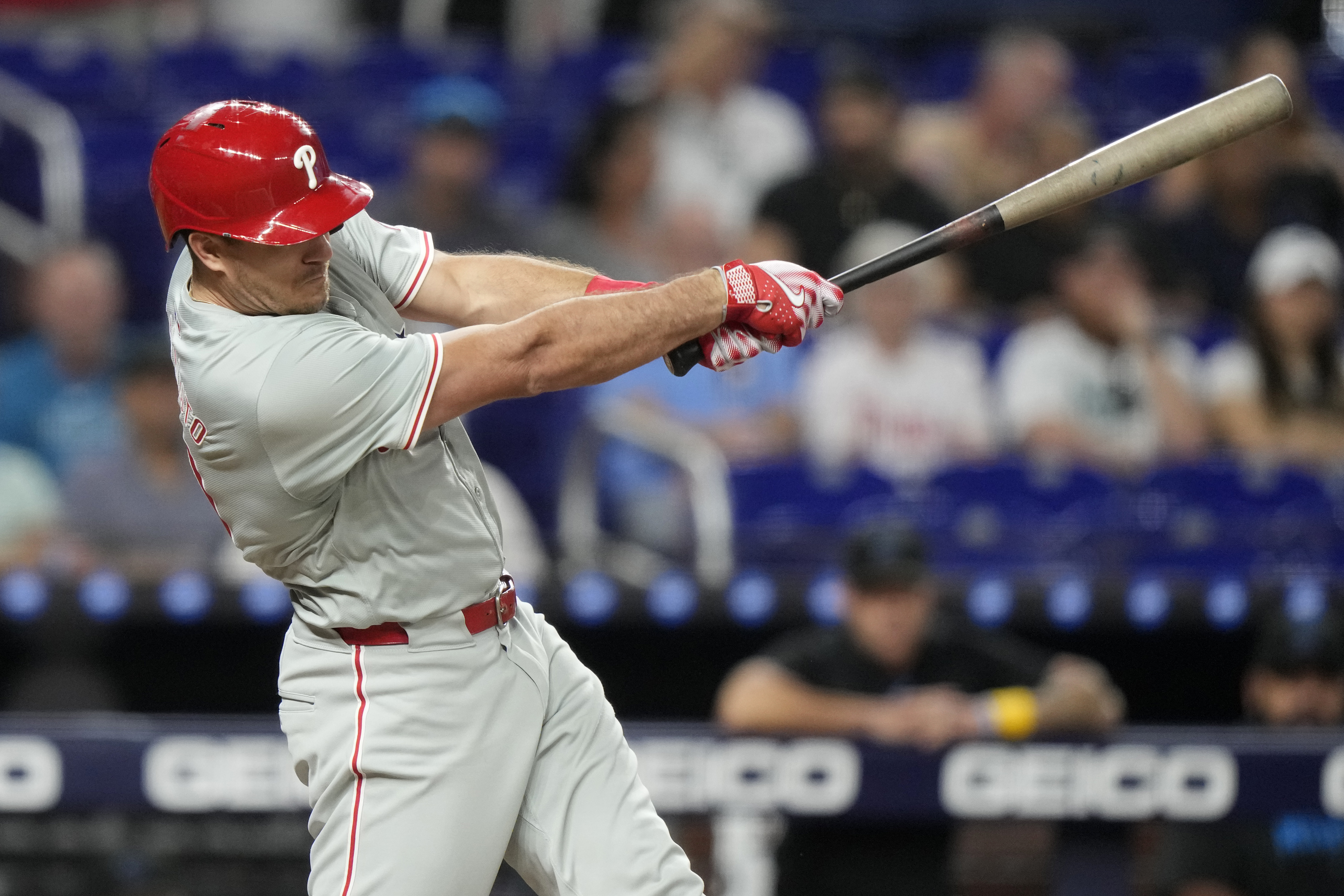 Philadelphia Phillies' J.T. Realmuto hits an RBI single to score Bryce Harper during the first inning of a baseball game against the Miami Marlins, Friday, Sept. 6, 2024, in Miami.