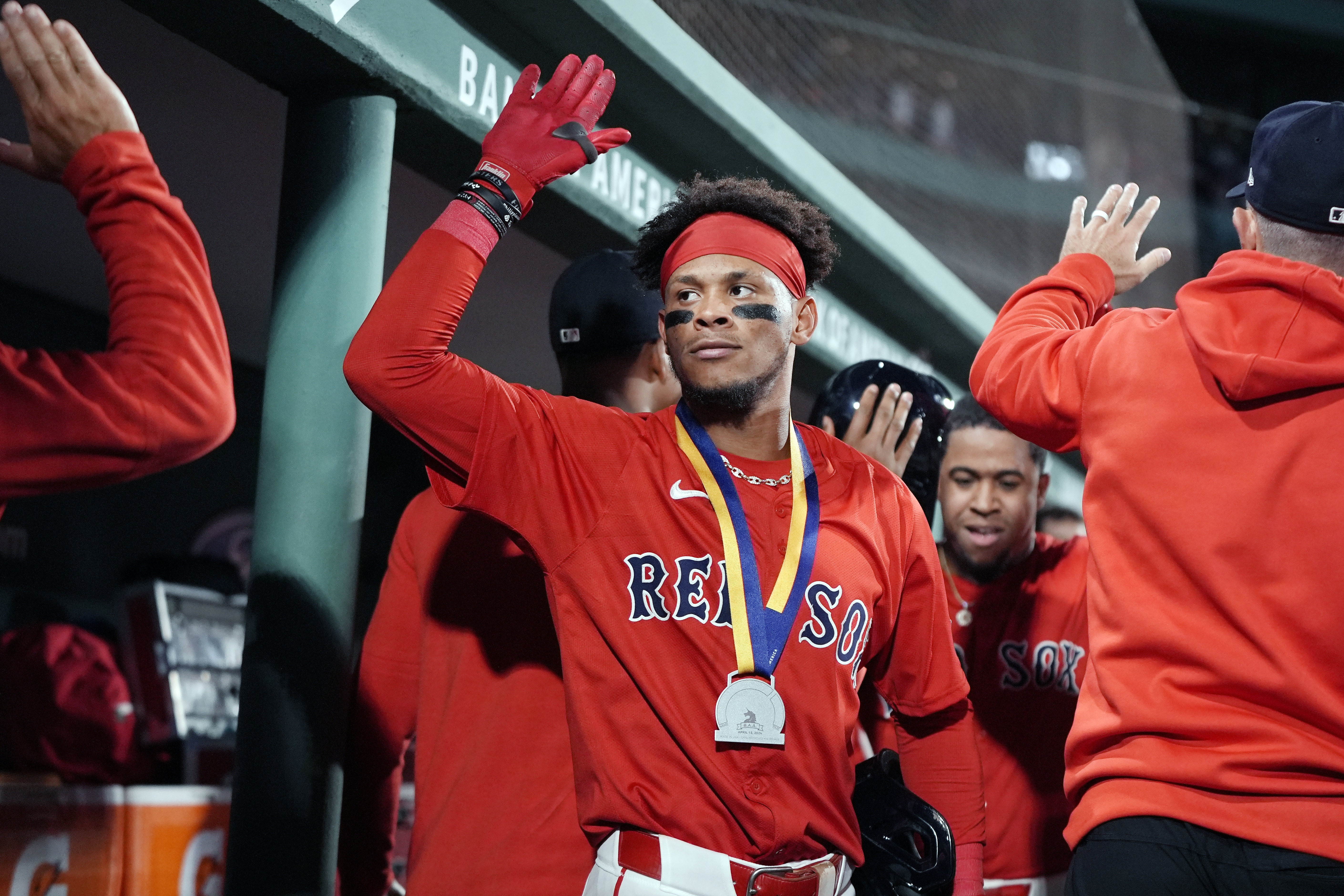 Boston Red Sox's Ceddanne Rafaela celebrates his two-run home run that also drove in Enmanuel Valdez, behind right, during the seventh inning of a baseball game against the Chicago White Sox, Friday, Sept. 6, 2024, in Boston. 
