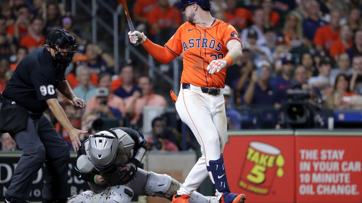 Umpire Mark Ripperger (90) reaches for Arizona Diamondbacks catcher Jose Herrera, center, who was hit in the head on the backswing by Houston Astros designated hitter Kyle Tucker, right, during the fifth inning of a baseball game Friday, Sept. 6, 2024, in Houston.