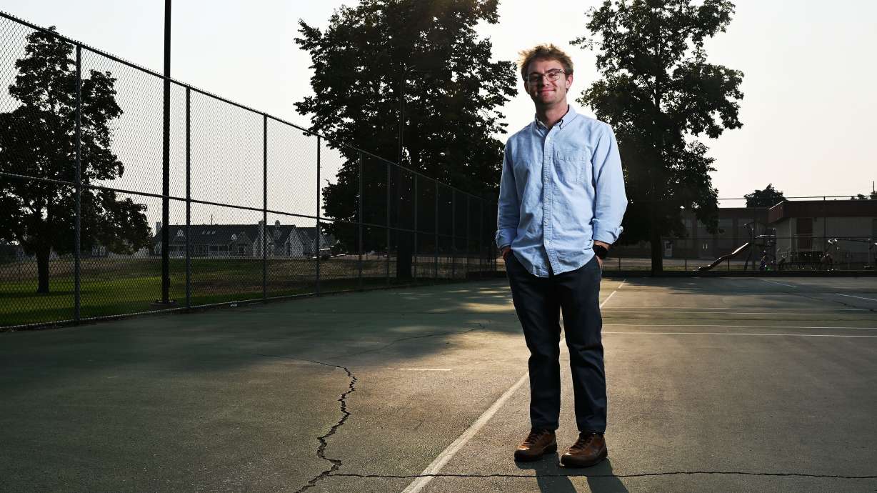 BYU student Caleb Johnson poses for photos in Provo on Sept. 4. College students — many of them first-time voters — are faced with the choice of two disparate candidates, or neither.
