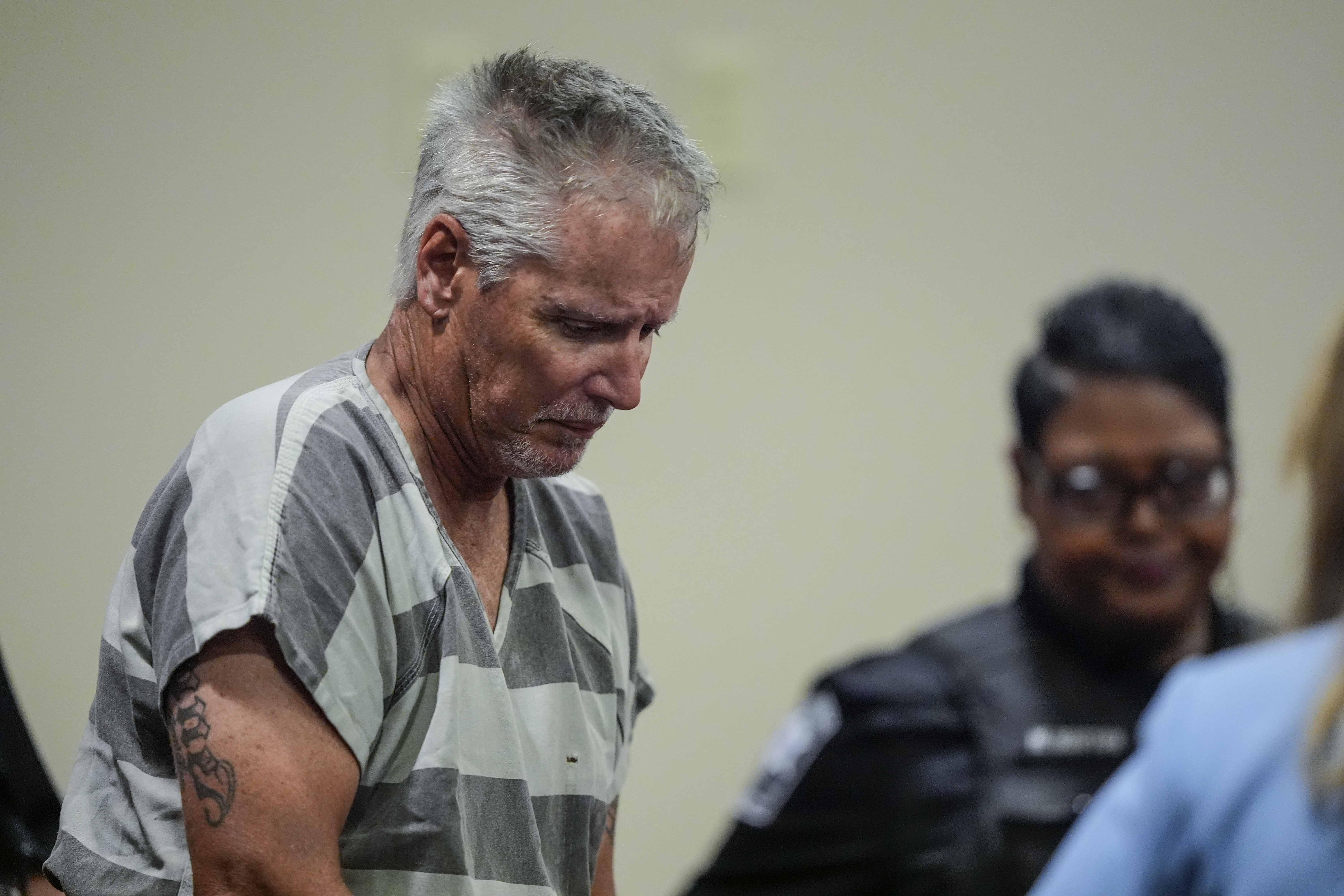 Colin Gray, 54, the father of alleged Apalachee High School shooter Colt Gray, 14, enters the Barrow County courthouse for his first appearance, on Friday, in Winder, Ga.