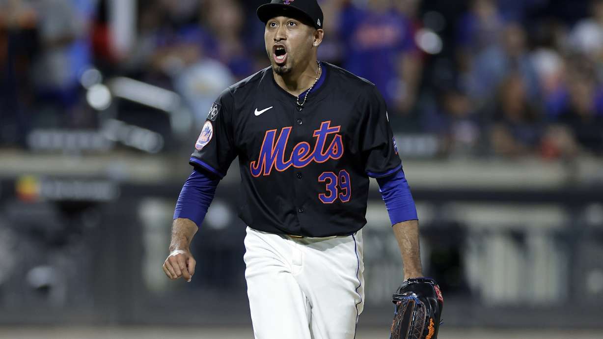 New York Mets pitcher Edwin Diaz reacts during the ninth inning of a baseball game against the Cincinnati Reds, Friday, Sept. 6, 2024, in New York.