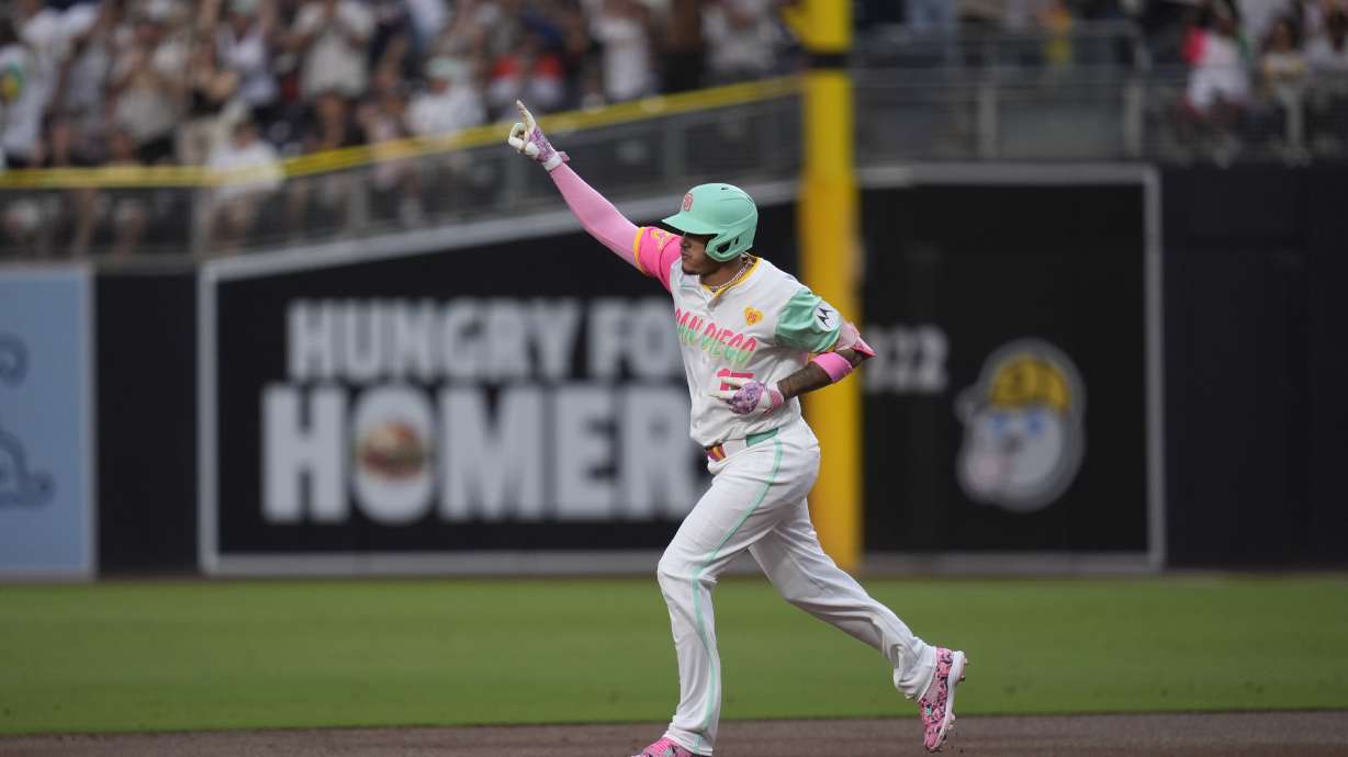 San Diego Padres' Manny Machado celebrates after hitting a home run during the first inning of a baseball game against the San Francisco Giants, Friday, Sept. 6, 2024, in San Diego.
