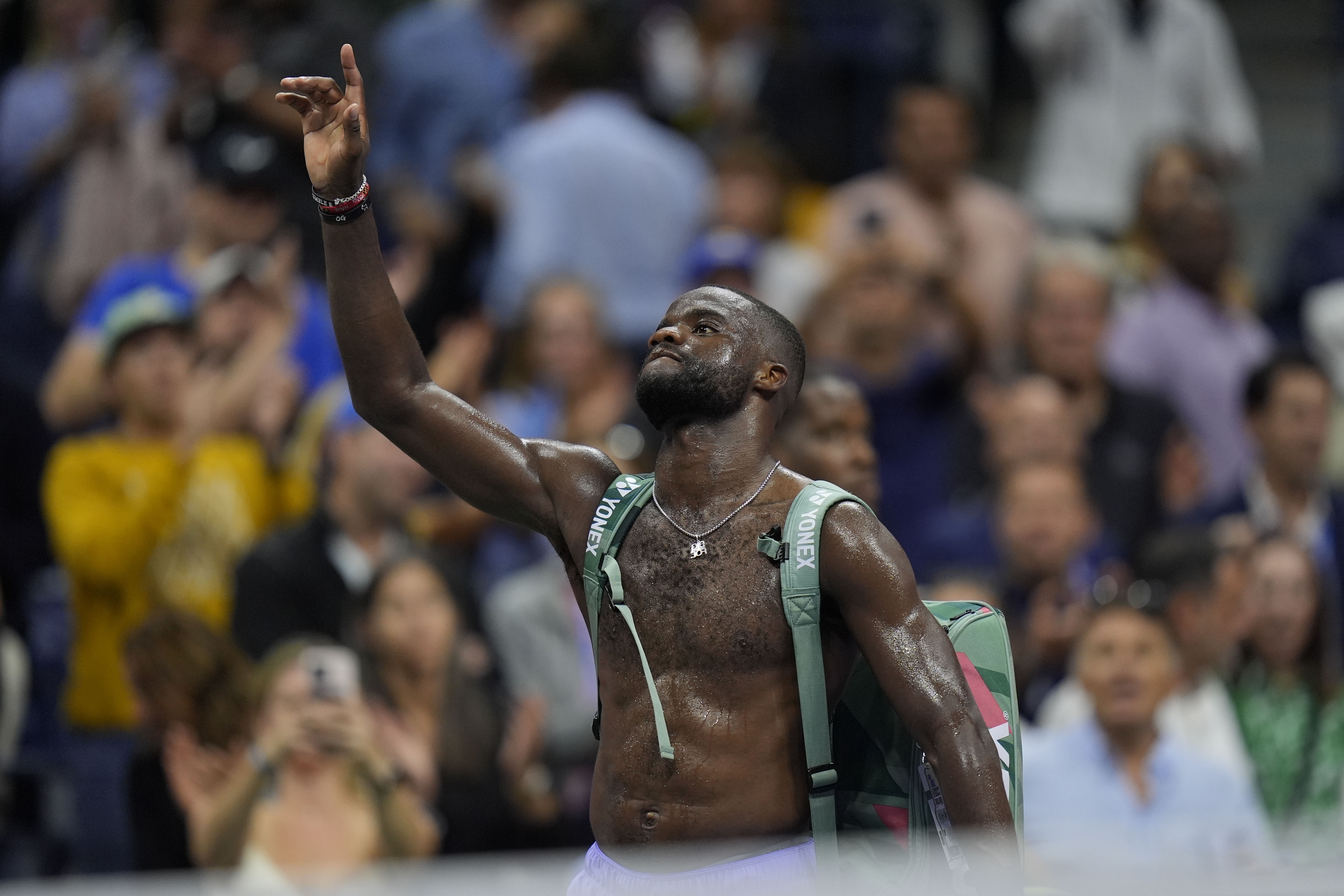 Frances Tiafoe, of the United States, waves to fans after being defeated by Taylor Fritz, of the United States, during the men's singles semifinals of the U.S. Open tennis championships, Friday, Sept. 6, 2024, in New York.