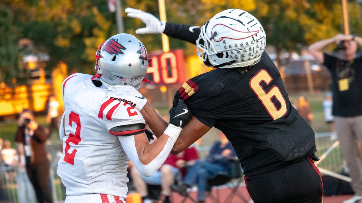 Viewmont receiver Kingston Mickens (6) attempts to catch a pass in the end zone over crosstown rival Bountiful's Brock McSwain (2) at Viewmont High on Sept. 6, 2024.
