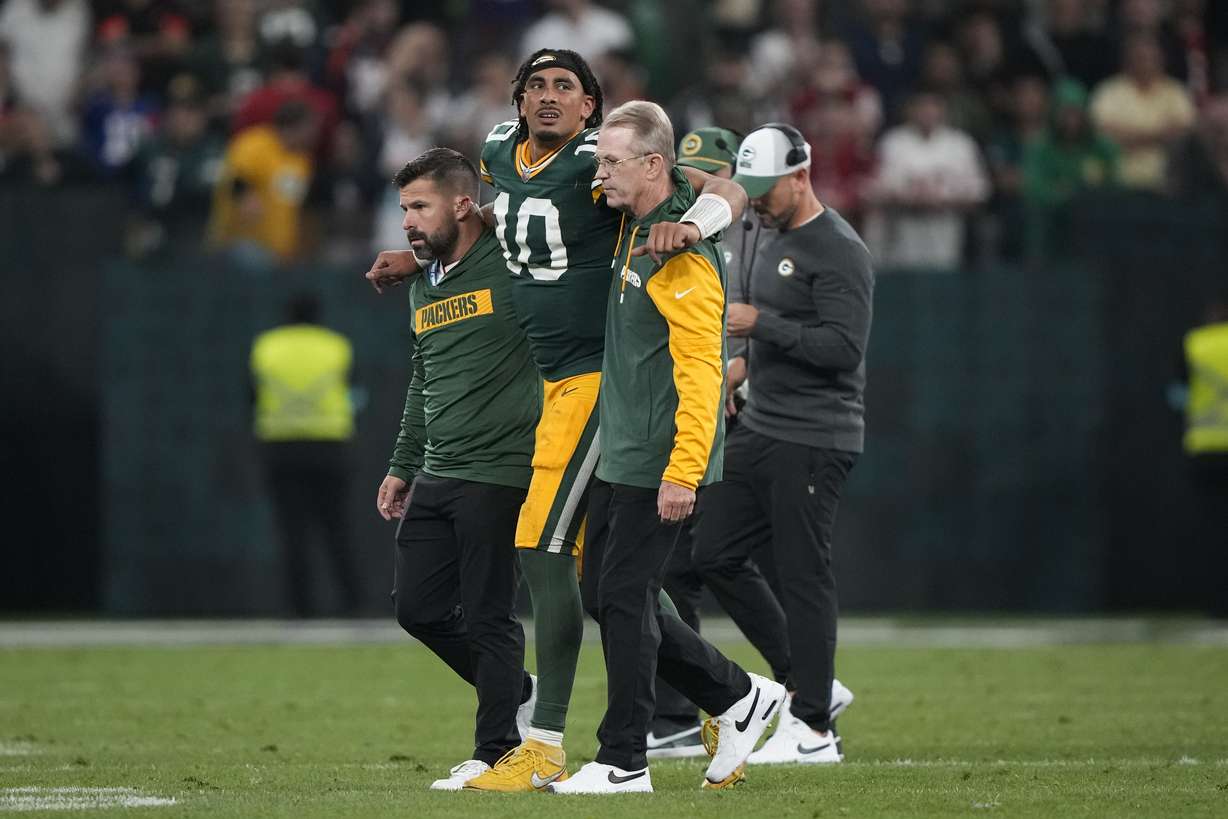 Green Bay Packers quarterback Jordan Love (10) is helped off the field after getting hurt during the second half of an NFL football game against the Philadelphia Eagles, Saturday, Sept. 7, 2024, at the Neo Quimica Arena in Sao Paulo.