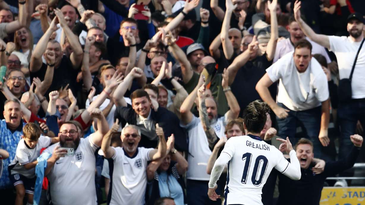 England's Jack Grealish, celebrates towards his side fans after scoring his sides second goal during the UEFA Nation's League soccer match between Ireland and England at the Aviva stadium in Dublin, Ireland, Saturday, Sept. 7, 2024.