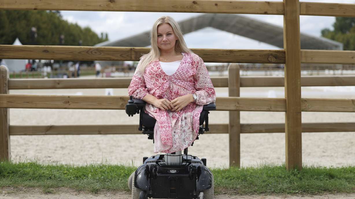 Stinna Tange Kaastrup of Denmark, a consultant for disability access for both the Olympic and Paralympic Games for the Versailles venue for Paris 2024, poses in front of the practice arena at Château de Versailles, Saturday, Sept. 7, 2024.