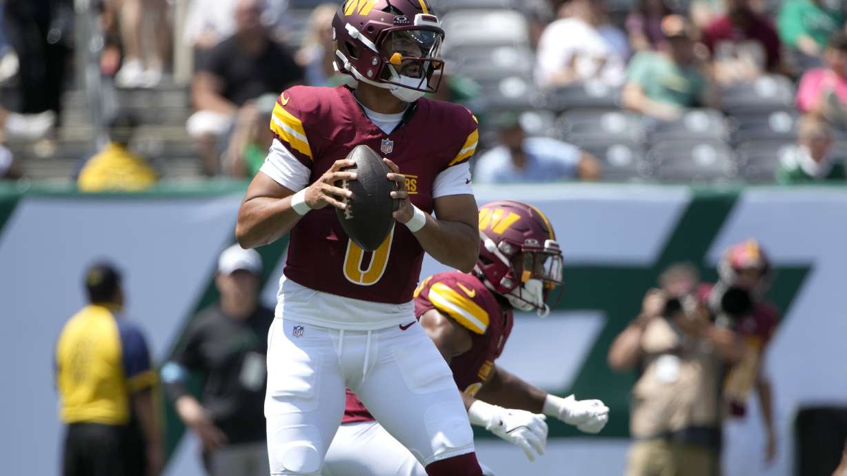 Washington Commanders quarterback Marcus Mariota drops back to pass during the first half of an NFL preseason football game against the New York Jets Saturday, Aug. 10, 2024, in East Rutherford. N.J.