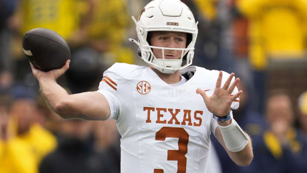Texas quarterback Quinn Ewers throws against Michigan in the first half of an NCAA college football game in Ann Arbor, Mich., Saturday, Sept. 7, 2024.