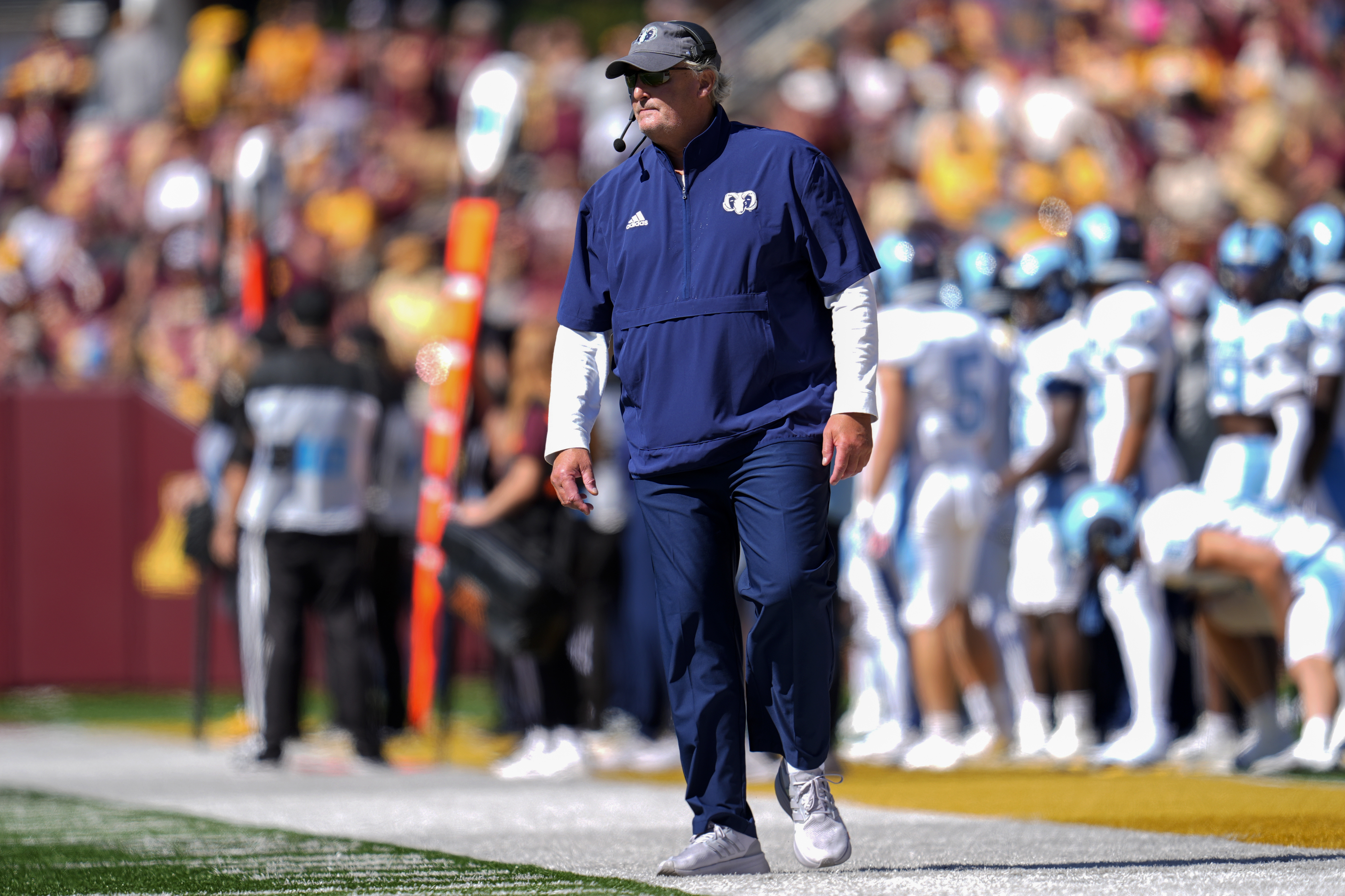 Rhode Island head coach Jim Fleming stands on the sideline during the first half of an NCAA college football game against Minnesota, Saturday, Sept. 7, 2024, in Minneapolis. 