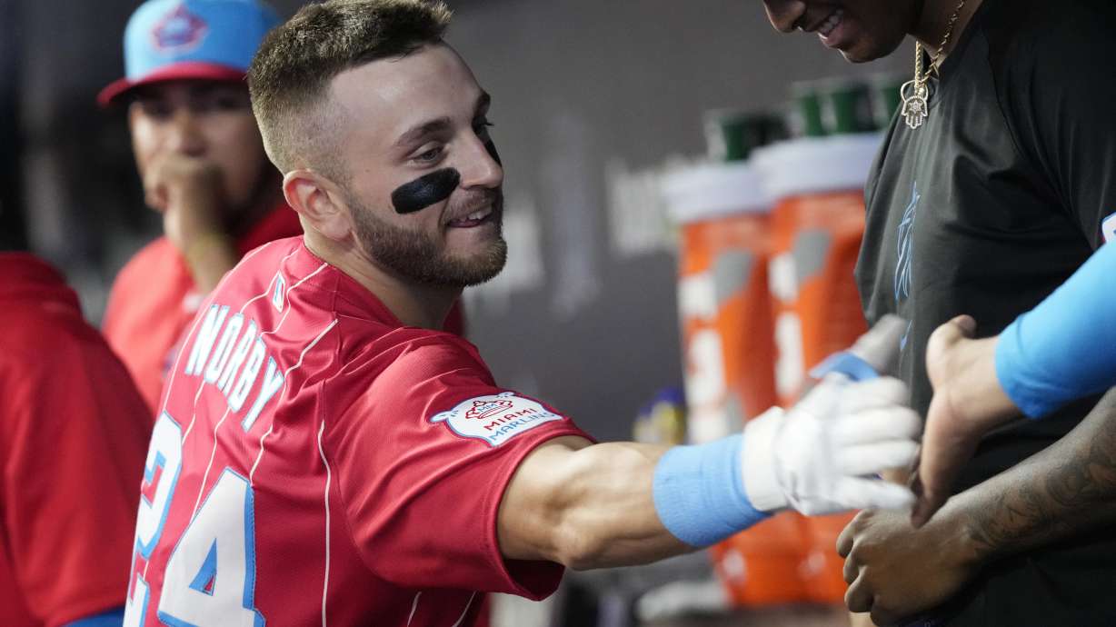 Miami Marlins' Connor Norby is congratulated by his teammates after hitting a two-run home run during the first inning of a baseball game against the Philadelphia Phillies, Saturday, Sept. 7, 2024, in Miami.