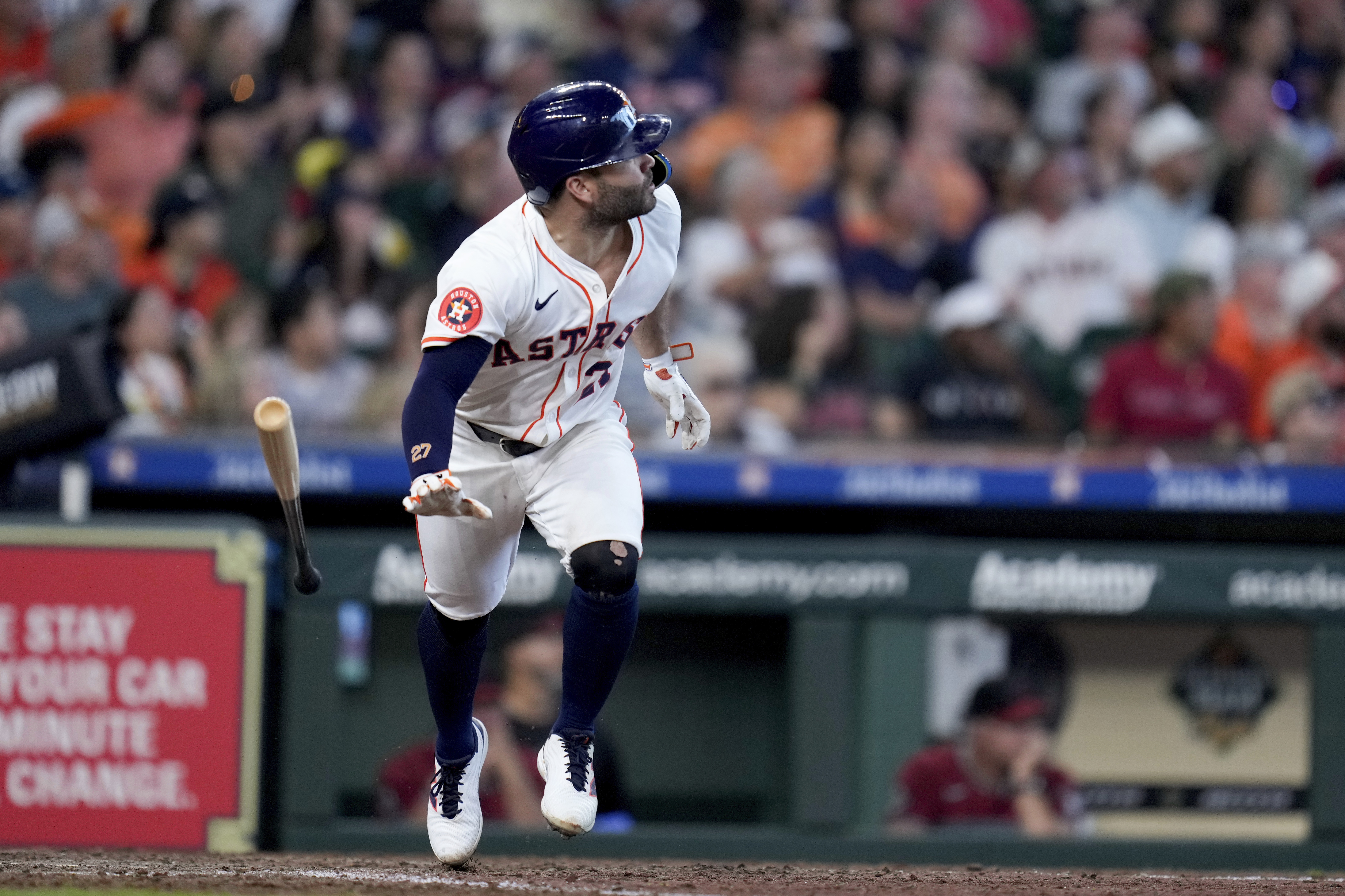 Houston Astros' Jose Altuve watches his solo home run against the Arizona Diamondbacks during the seventh inning of a baseball game Saturday, Sept. 7, 2024, in Houston.