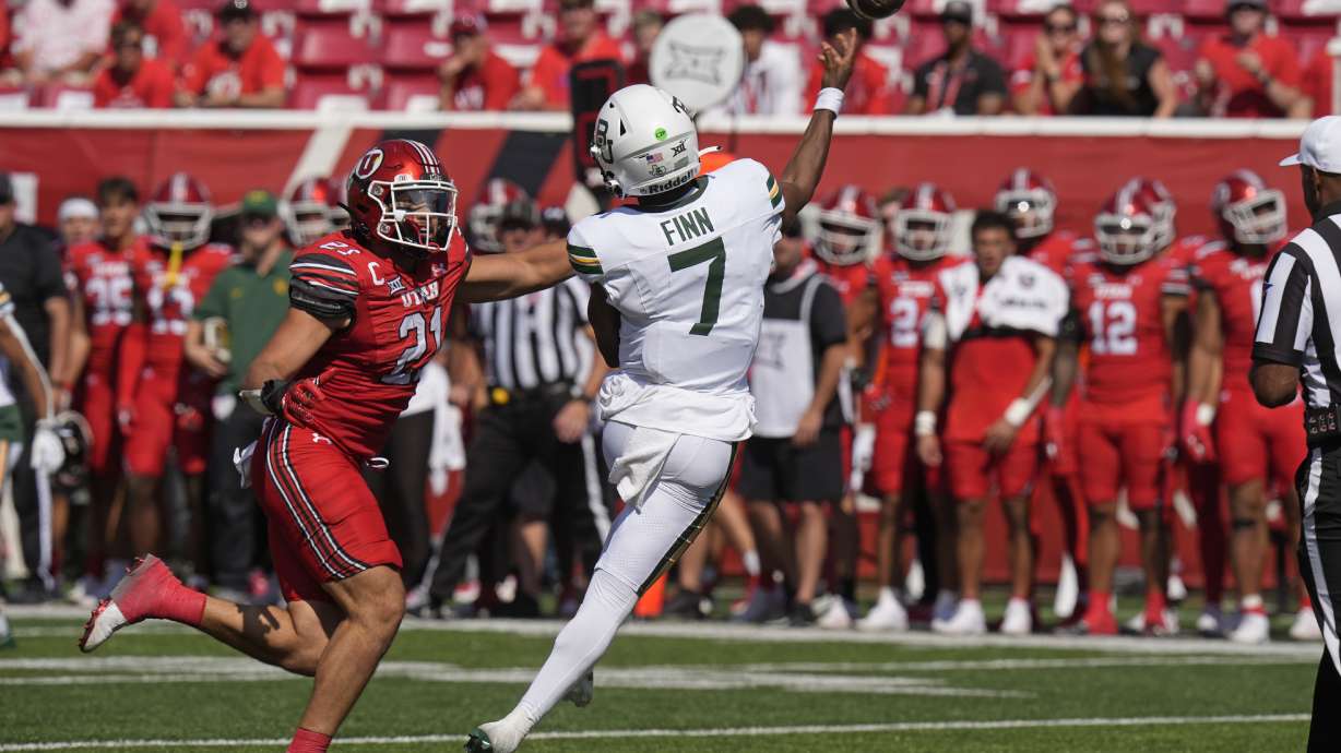 Utah linebacker Karene Reid (21) purses Baylor quarterback Dequan Finn (7) in the second half during an NCAA college football game Saturday, Sept. 7, 2024, in Salt Lake City.