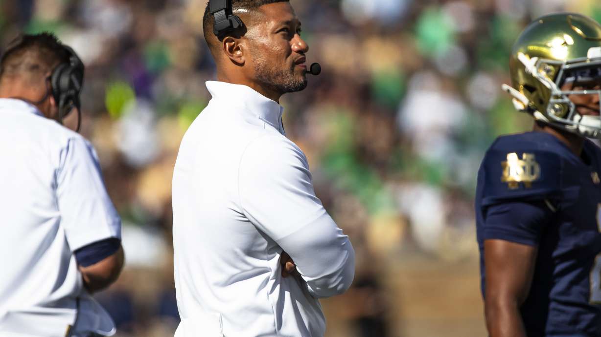Notre Dame head coach Marcus Freeman looks to the scoreboard during an NCAA college football game against Northern Illinois, Saturday, Sept. 7, 2024, in South Bend, Ind.
