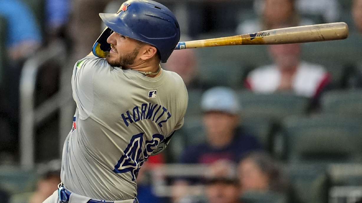 Toronto Blue Jays' Spencer Horwitz (48) hits a solo homer in the first inning of a baseball game against the Atlanta Braves, Saturday, Sept. 7, 2024, in Atlanta.