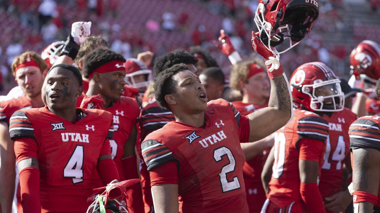 Utah Utes running back Micah Bernard (2) holds his helmet in the air as the team sings "Utah Man" after their win against Baylor at Rice-Eccles Stadium on the campus of the University of Utah in Salt Lake City on Saturday, Sept. 7, 2024. Utah won the game 23-12.