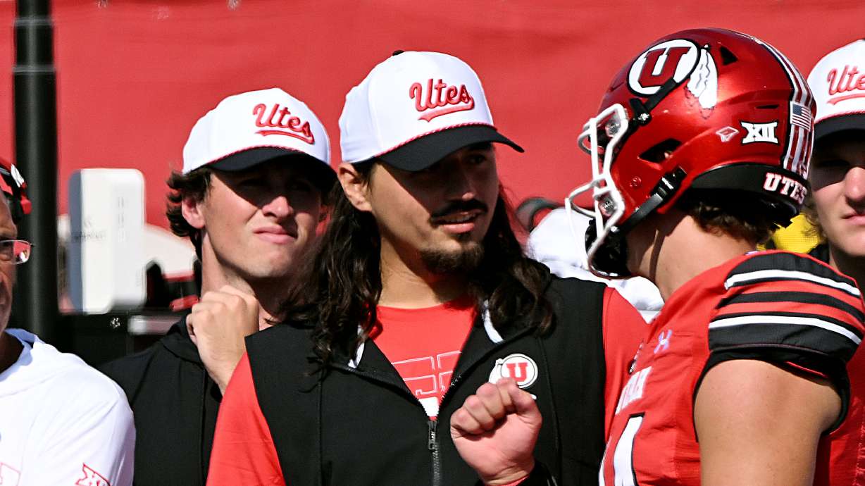 Utah Utes quarterback Cameron Rising (7) talks with Utah Utes quarterback Sam Huard (14) as Utah and Baylor play at Rice-Eccles Stadium in Salt Lake City on Saturday, Sept. 7, 2024. Utah won 23-12. Rising was injured during the game, ending his day.