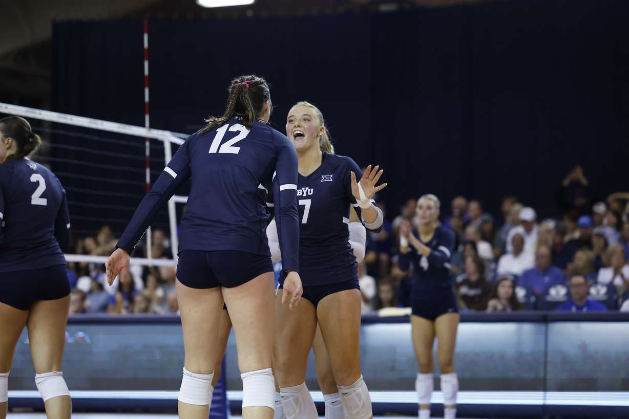 BYU setter Alex Bower and outside hitter Claire Little (12) celebrate a point during an NCAA women's volleyball match against No. 19 Georgia Tech, Saturday, Sept. 7, 2024 in the Smith Fieldhouse in Provo, Utah.