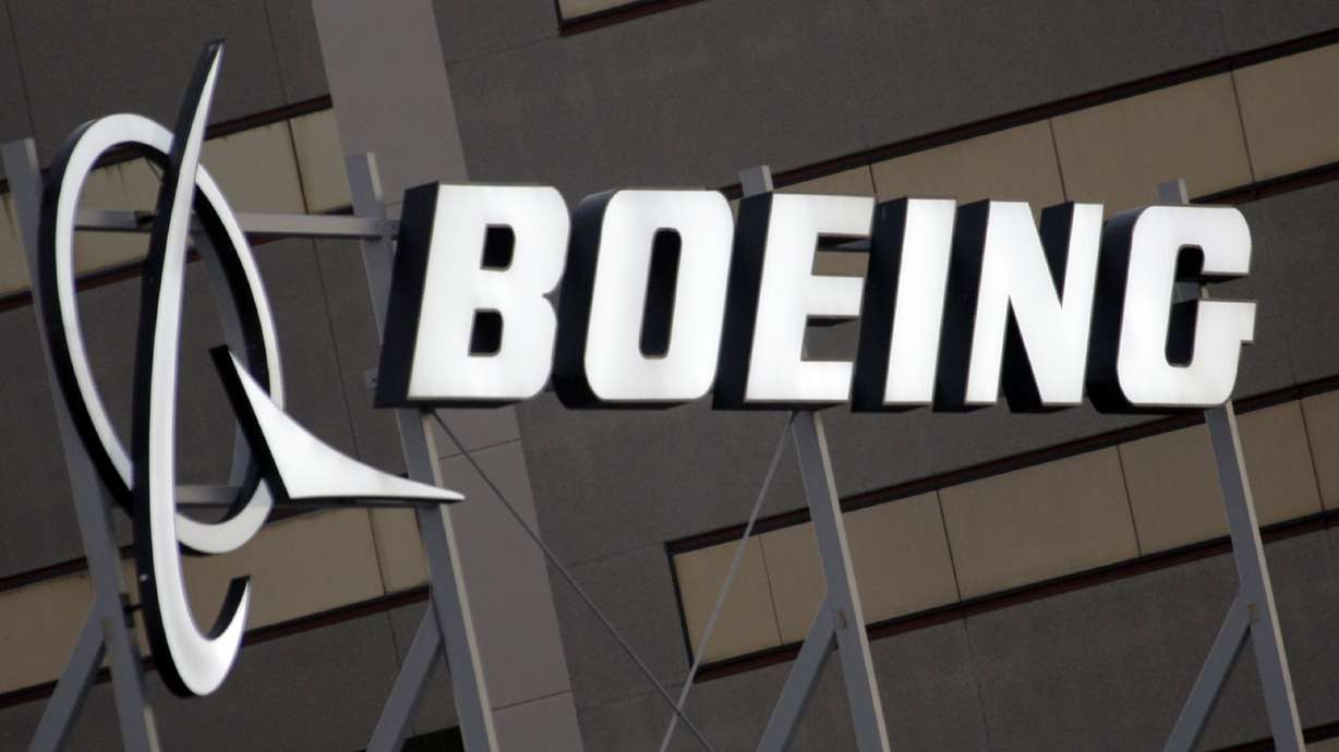 Boeing has a tentative agreement with its largest union on a new contract for factory workers that could avoid a threatened strike.
