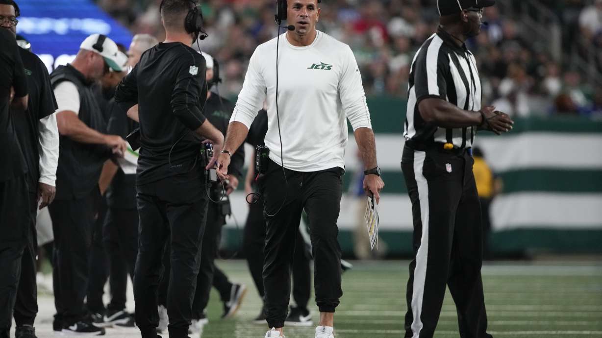 New York Jets head coach Robert Saleh, center, walks on the sideline during the first half of a preseason NFL football game against the New York Giants, Saturday, Aug. 24, 2024, in East Rutherford, N.J.