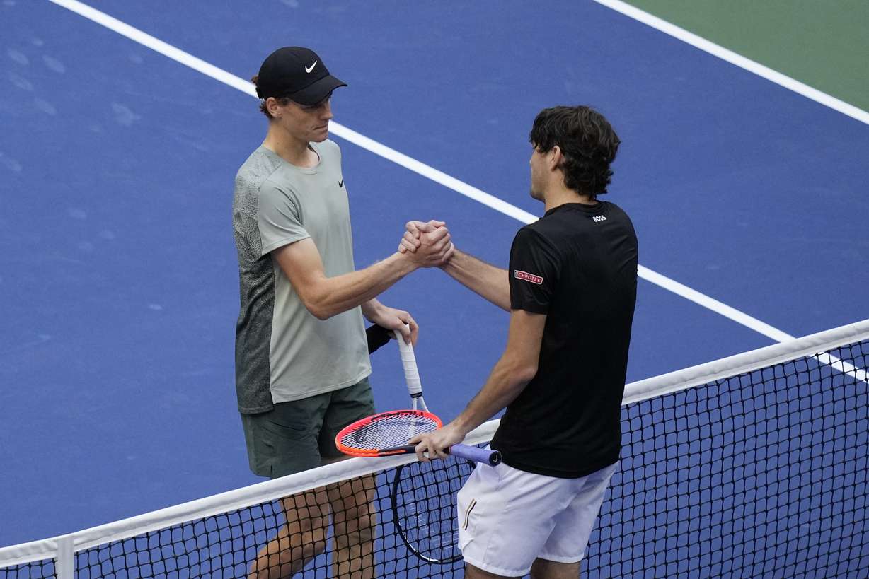 Jannik Sinner, left, of Italy, greets Taylor Fritz, of the United States, after winning the men's singles final of the U.S. Open tennis championships, Sunday, Sept. 8, in New York. 2024.