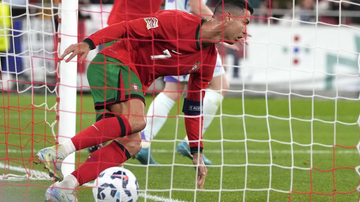 Portugal's Cristiano Ronaldo celebrates after scoring his side's second goal during the UEFA Nations League soccer match between Portugal and Scotland at the Luz stadium in Lisbon, Portugal, Sunday, Sept. 8, 2024.