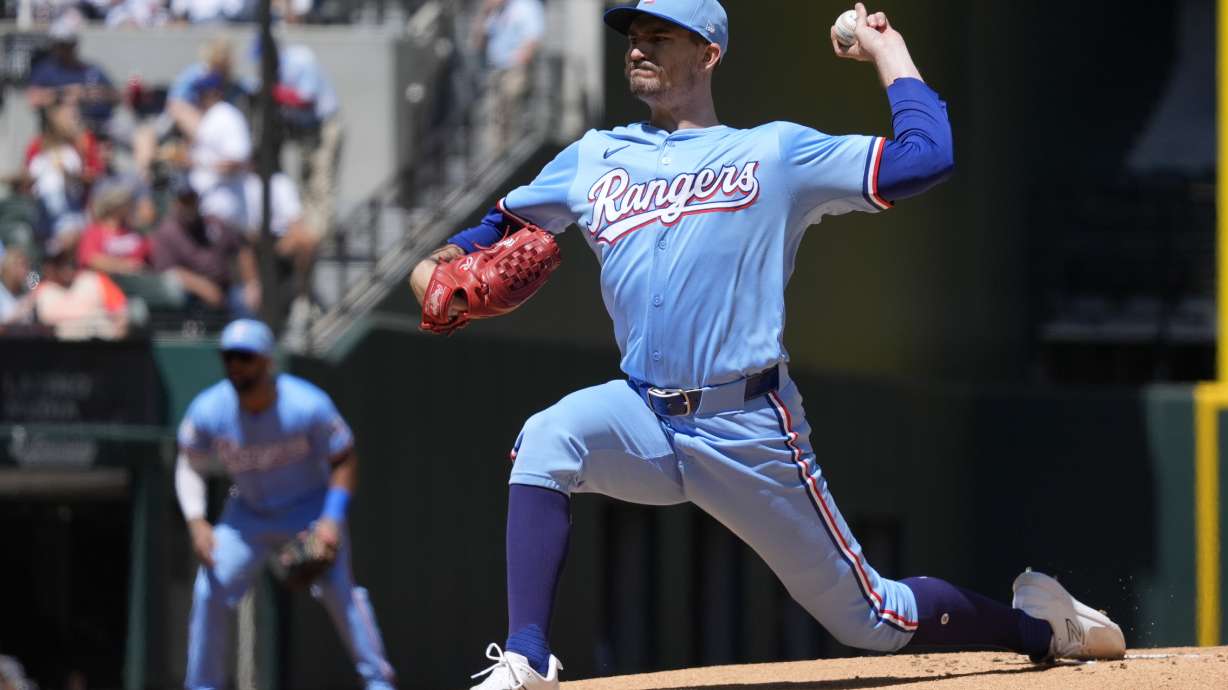Texas Rangers starting pitcher Andrew Heaney throws during the first inning of a baseball game against the Los Angeles Angels, Sunday, Sept. 8, 2024, in Arlington, Texas.