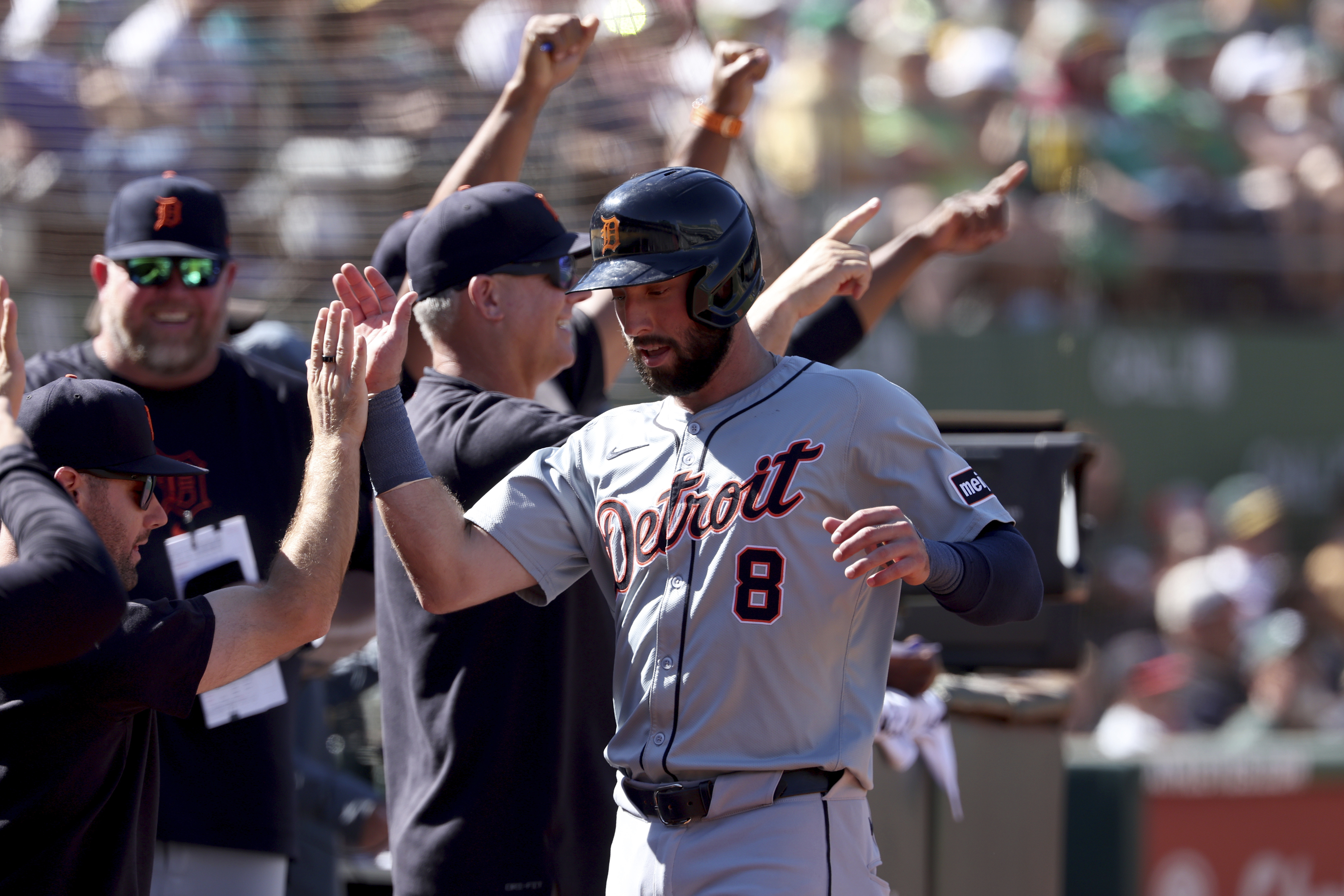 Detroit Tigers' Matt Vierling (8) celebrates after scoring on an RBI single by Riley Greene during the eighth inning of a baseball game against the Oakland Athletics in Oakland, Calif., Sunday, Sept. 8, 2024.