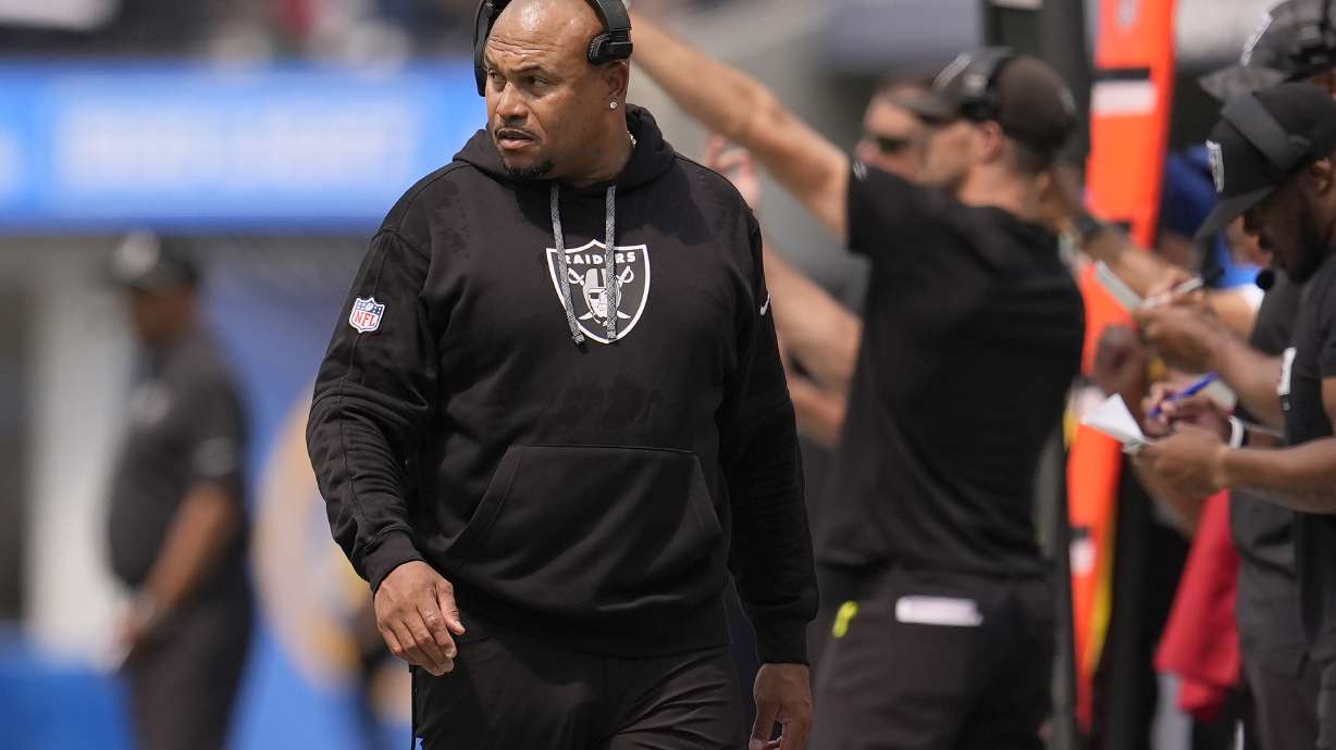 Las Vegas Raiders head coach Antonio Pierce walks on the sideline during the first half of an NFL football game against the Los Angeles Chargers, Sunday, Sept. 8, 2024, in Inglewood, Calif.