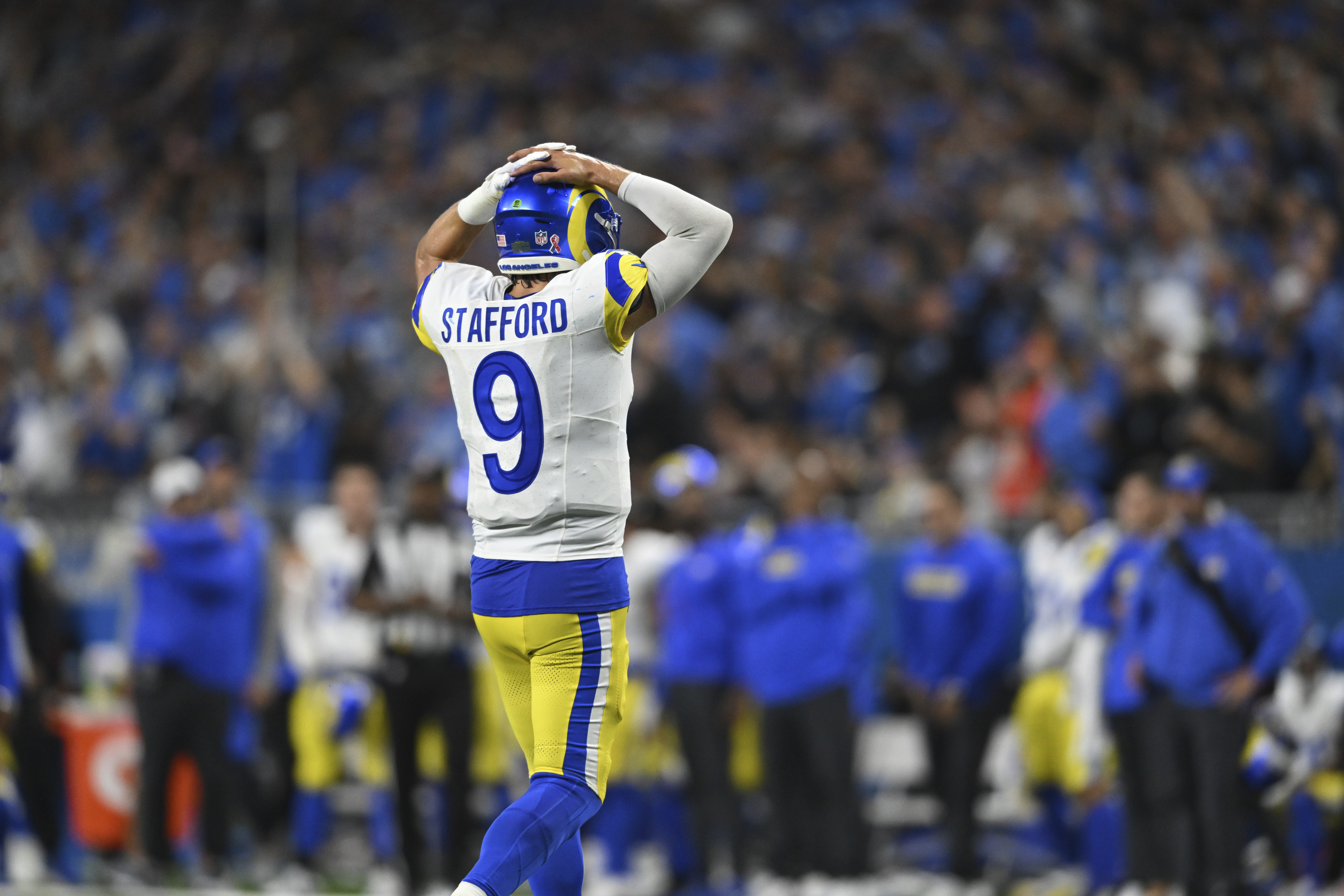 Los Angeles Rams quarterback Matthew Stafford (9) walks to the bench against the Detroit Lions during the second half of an NFL football game in Detroit, Sunday, Sept. 8, 2024.