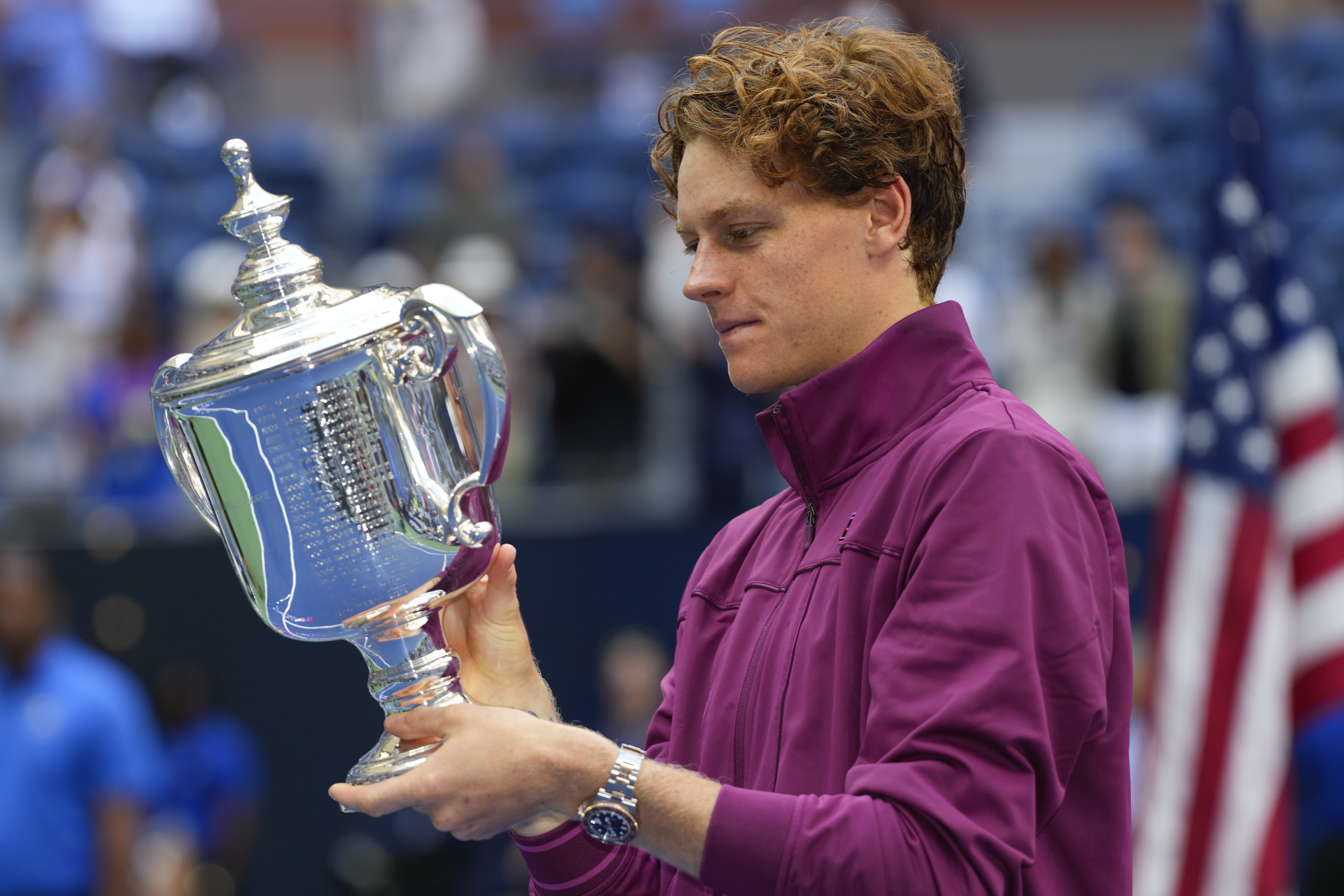 Jannik Sinner, of Italy, holds the championship trophy after defeating Taylor Fritz, of the United States, in the men's singles final of the U.S. Open tennis championships, Sunday, Sept. 8, 2024, in New York.