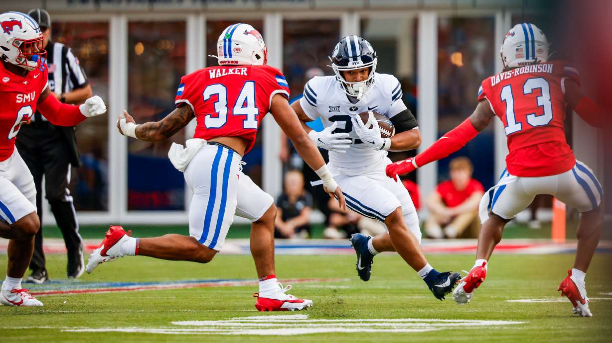 BYU running back LJ Martin rushes for positive yardage during an NCAA football game against SMU, Friday, Sept. 6, 2024 in University Park, Texas.