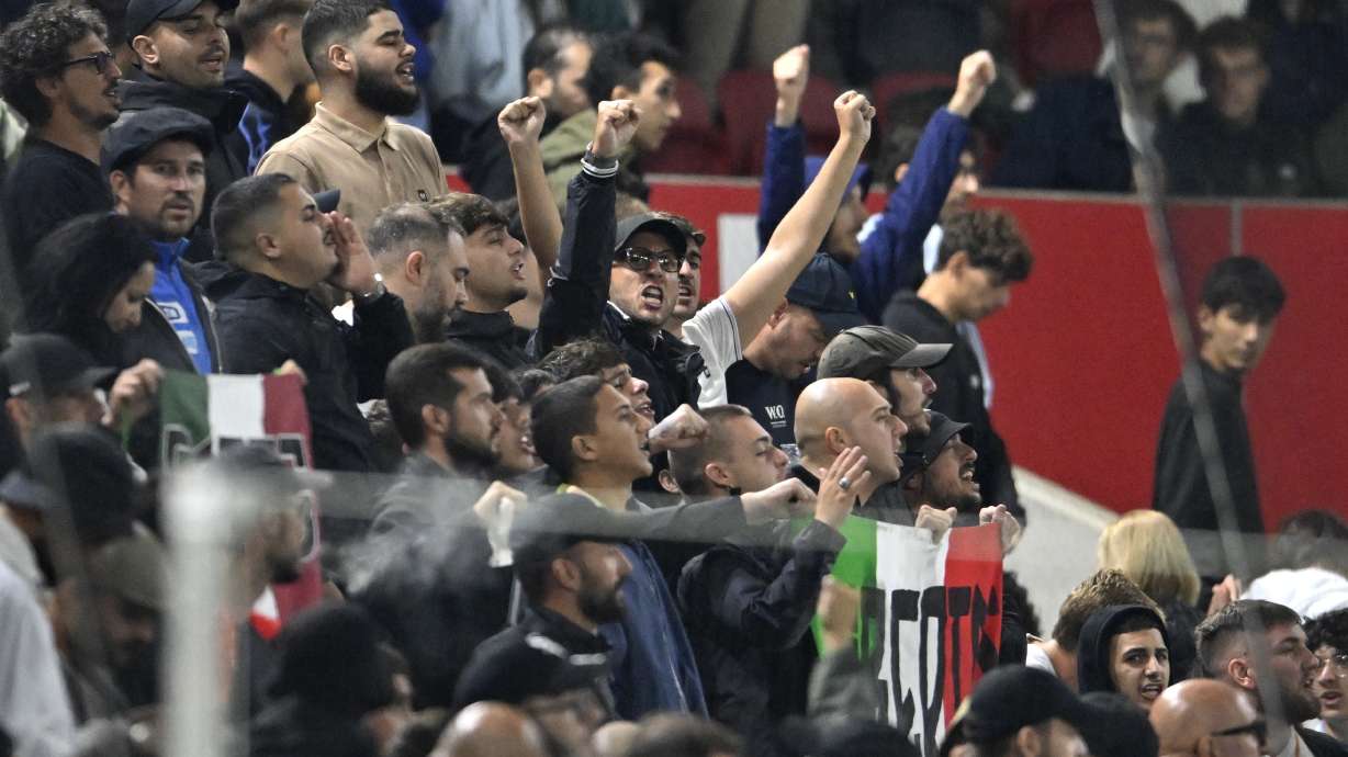 Italy's fans cheer their team during the UEFA Nations League soccer match between Israel and Italy, at Bozsik Arena, in Budapest, Hungary, Monday, Sept. 9, 2024.