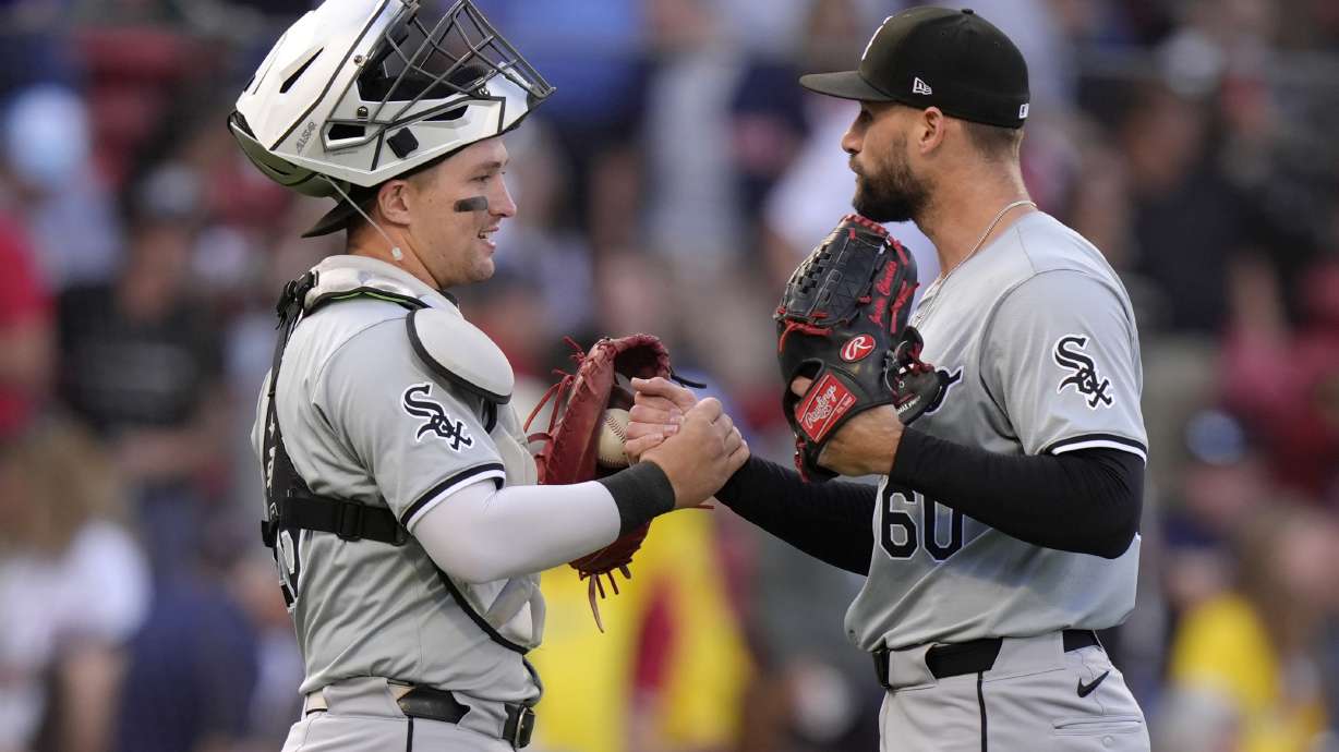 Chicago White Sox catcher Korey Lee, left, celebrates with pitcher Justin Anderson, right, after the defeating the Boston Red Sox in a baseball game, Sunday, Sept. 8, 2024, in Boston.