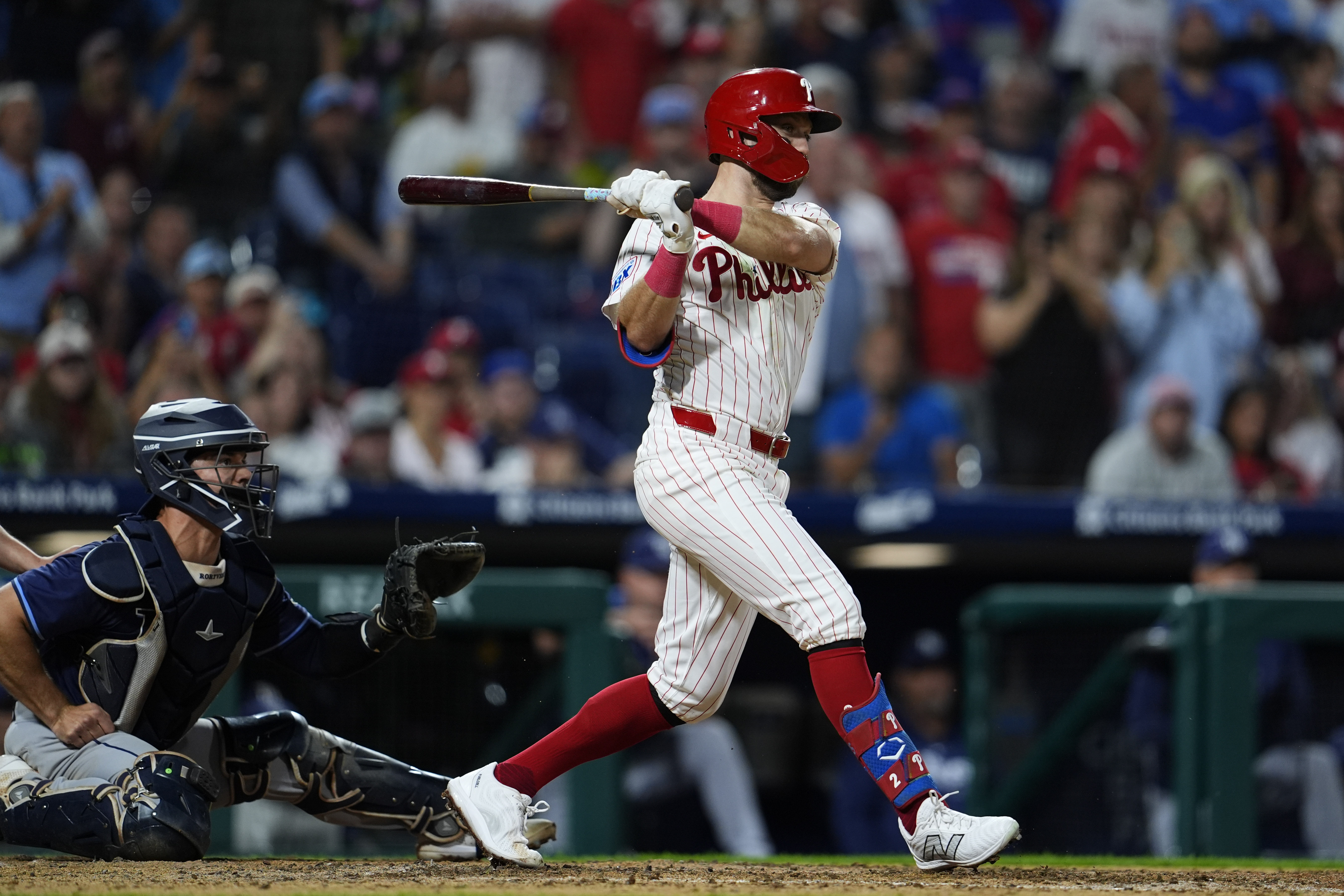 Philadelphia Phillies' Kody Clemens, right, watches his walkoff single off Tampa Bay Rays' Garrett Cleavinger during the ninth inning of a baseball game, Monday, Sept. 9, 2024, in Philadelphia.