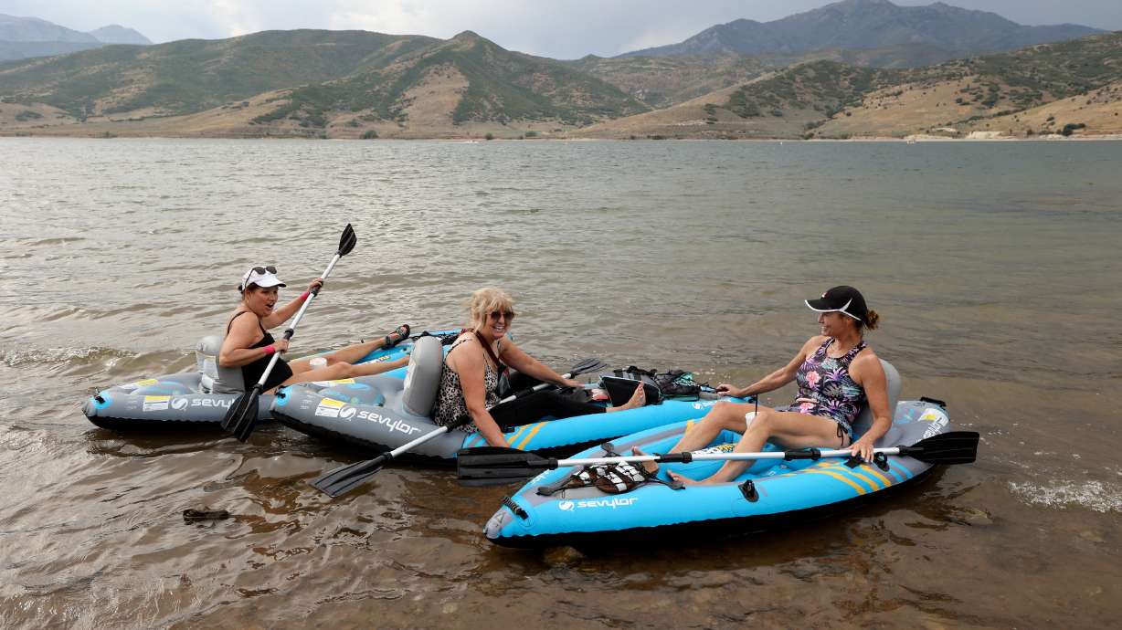 Nan Black, Mary Beth Crane and Lisa Barhoum kayak in Deer Creek Reservoir in Wasatch County on Monday. Statewide reservoir storage across Utah remains at an average of 77% capacity, an overall 6% decline from last month.