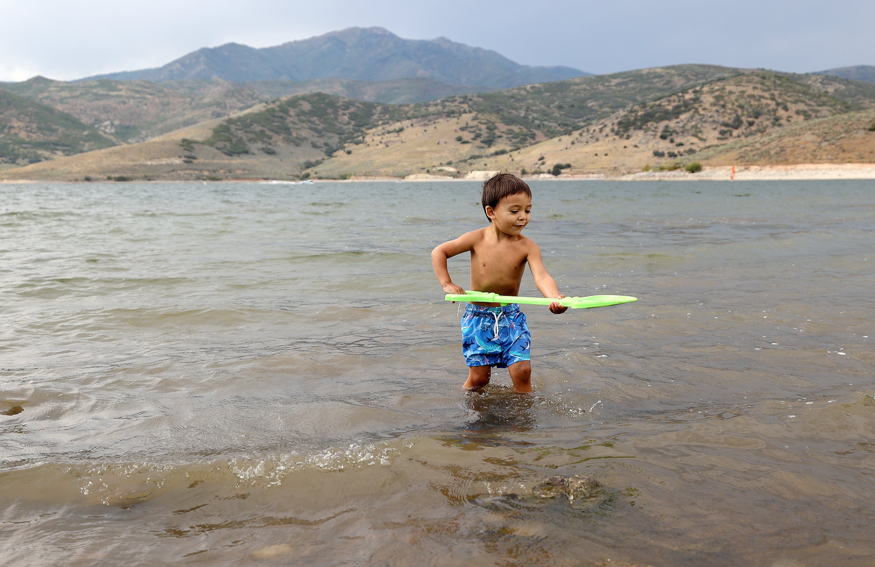 Silas Guillen plays in Deer Creek Reservoir in Wasatch County on Monday.