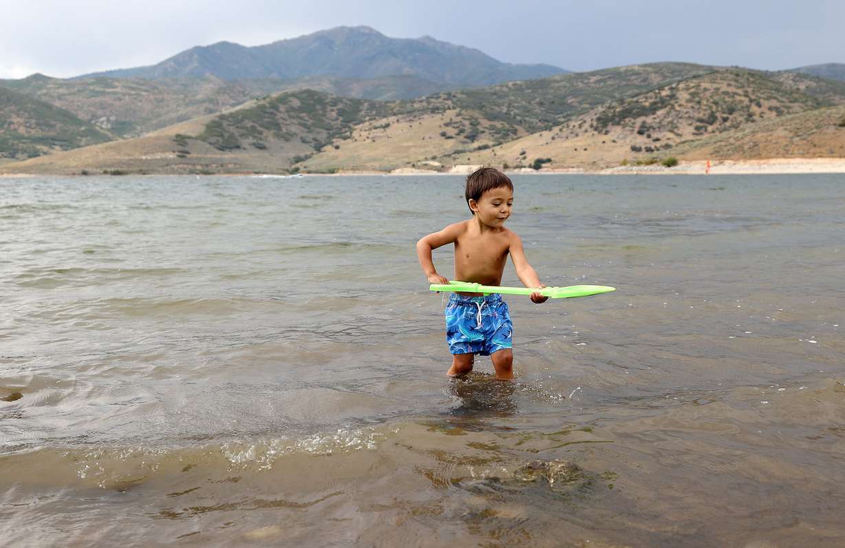 Silas Guillen plays in Deer Creek Reservoir in Wasatch County on Monday.