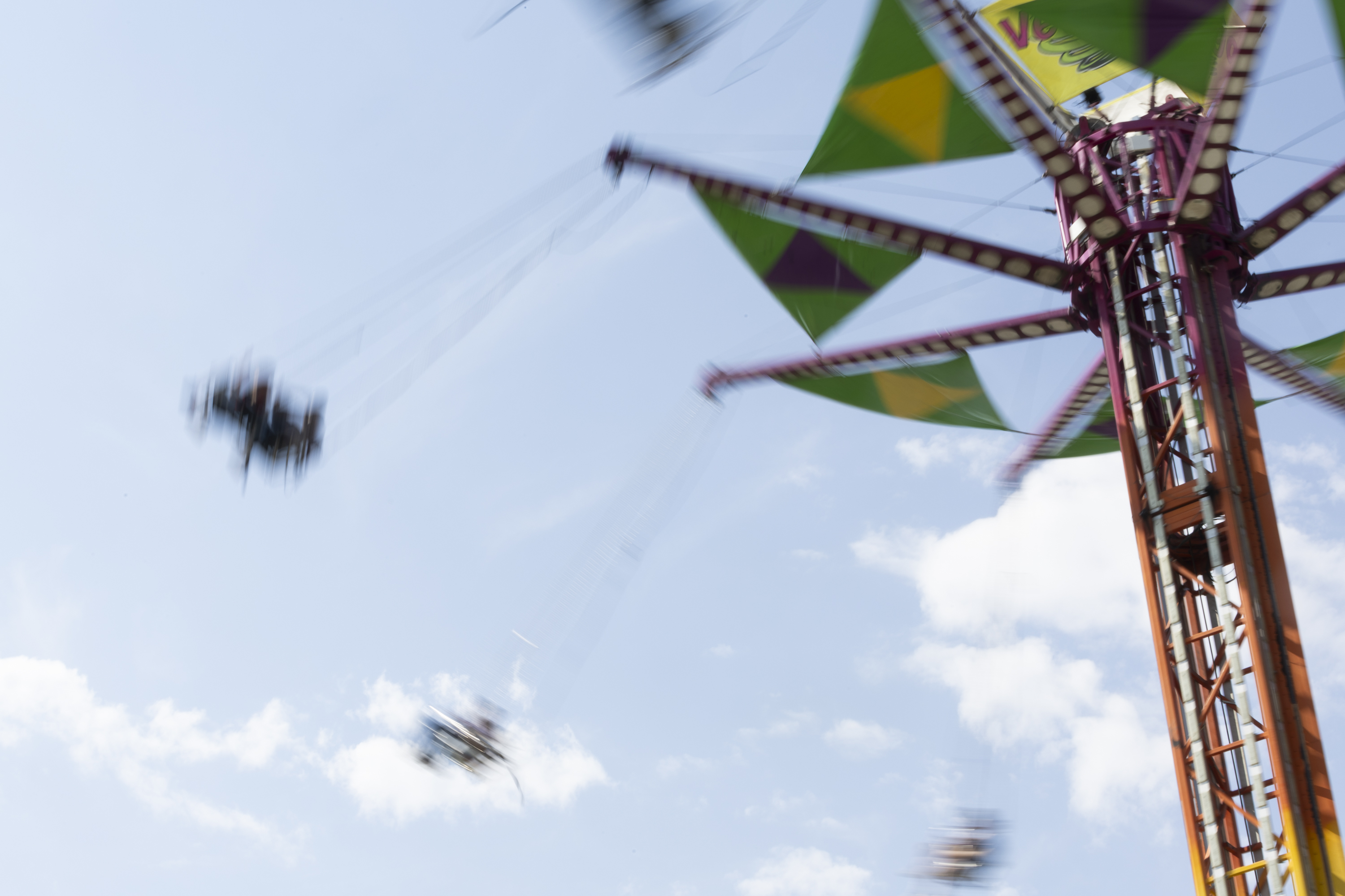 People ride on the carnival rides during the Utah State Fair at the Utah State Fairpark in Salt Lake City on Sunday.