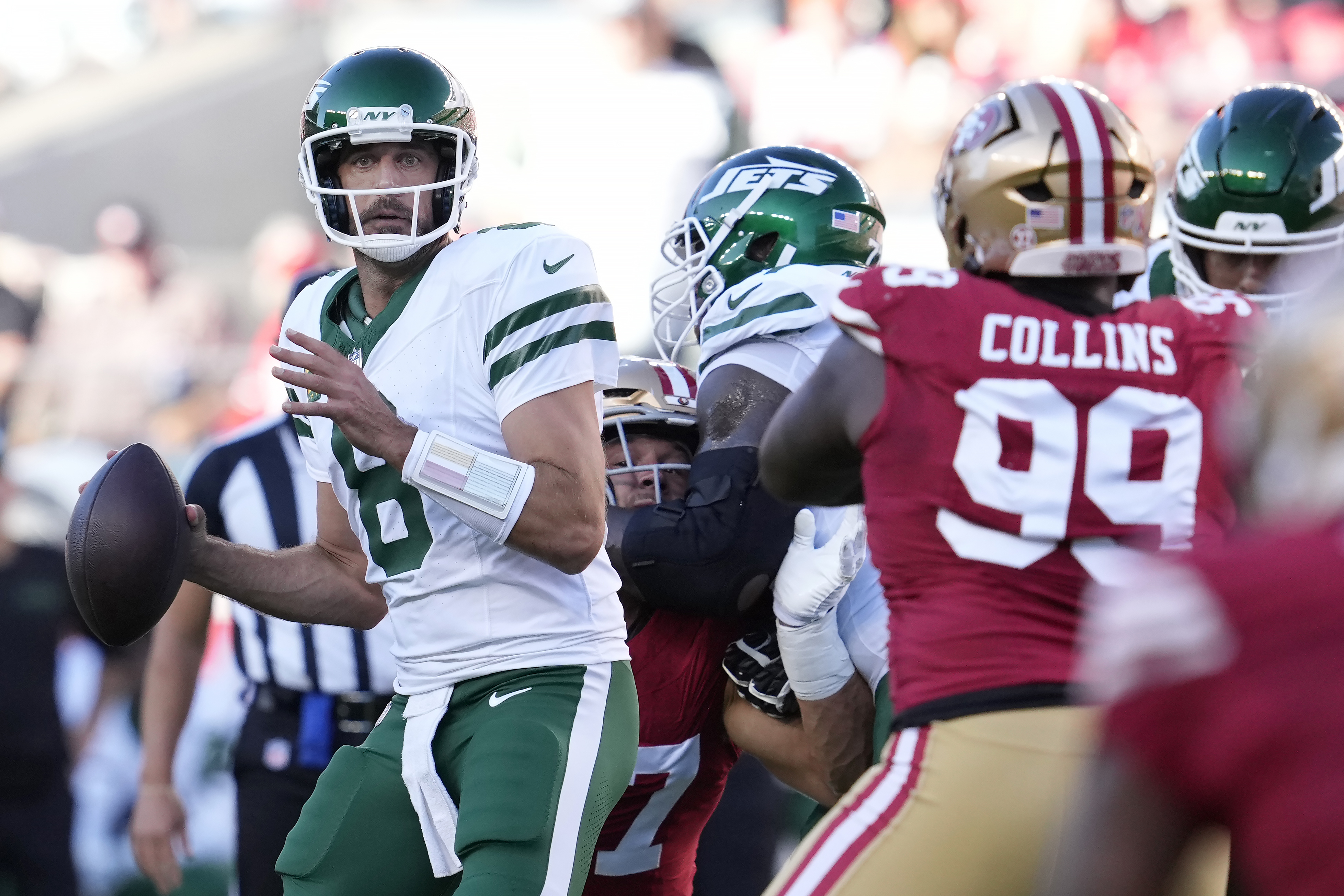 New York Jets quarterback Aaron Rodgers (8) looks to pass the ball during the first half of an NFL football game against the San Francisco 49ers in Santa Clara, Calif., Monday, Sept. 9, 2024.