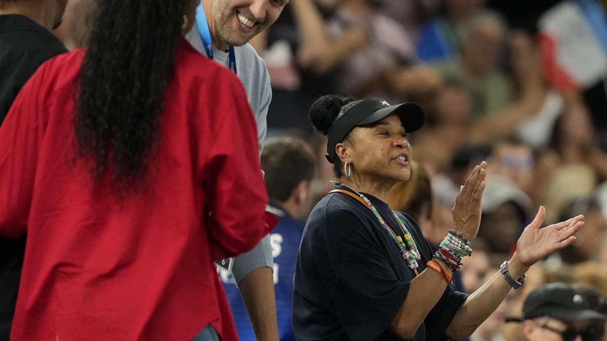 Dawn Staley claps during a women's gold medal basketball game at Bercy Arena at the 2024 Summer Olympics, Sunday, Aug. 11, 2024, in Paris, France.