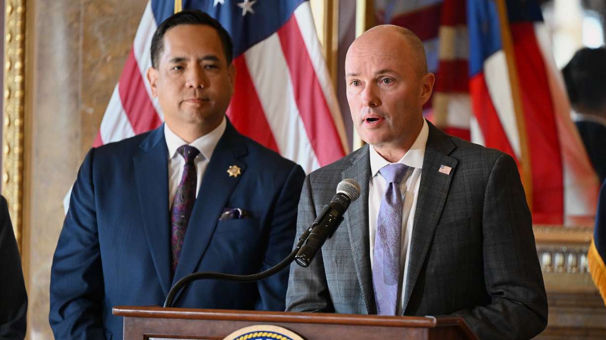 Gov. Spencer Cox holds a press conference with Utah Attorney General Sean Reyes to discuss a lawsuit filed against TikTok, at the state Capitol in Salt Lake City on Oct. 10, 2023. On Tuesday, 42 attorneys general demanded Congress require warning labels on social media apps.