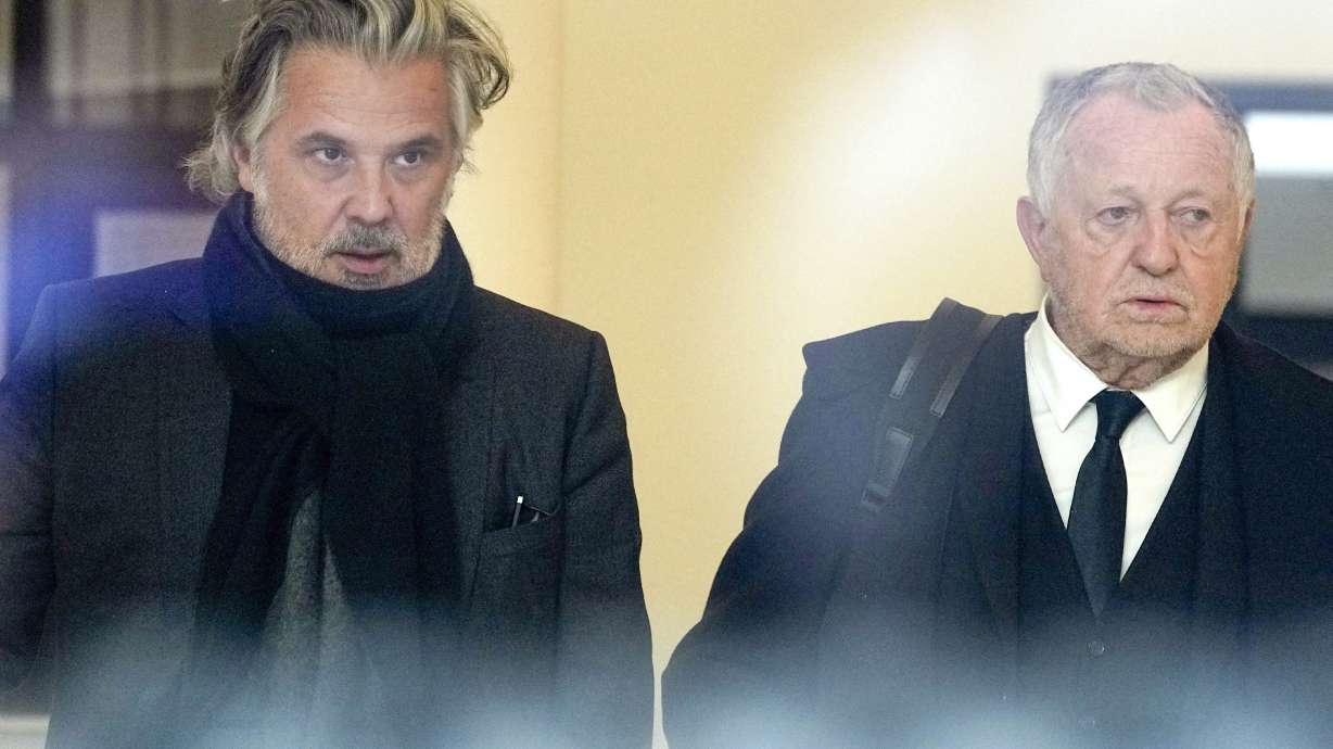 FILE - Vincent Labrune, left, head of the French soccer league, and Jean-Michel Aulas, President of the Olympique Lyonnais soccer team, leave the French soccer federation, Jan. 11, 2023, in Paris.