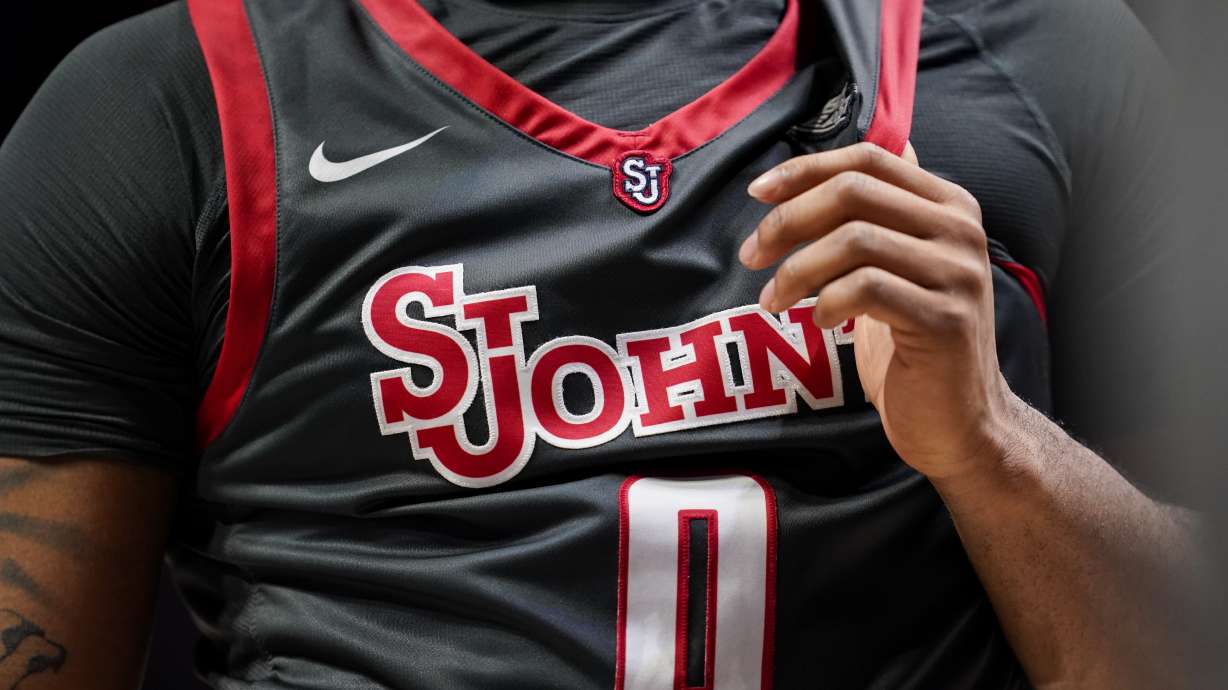 FILE - St. John's Posh Alexander (0) holds onto his jersey during a stoppage in play in the second half of an NCAA college basketball game against Xavier, Feb. 4, 2023, in Cincinnati.