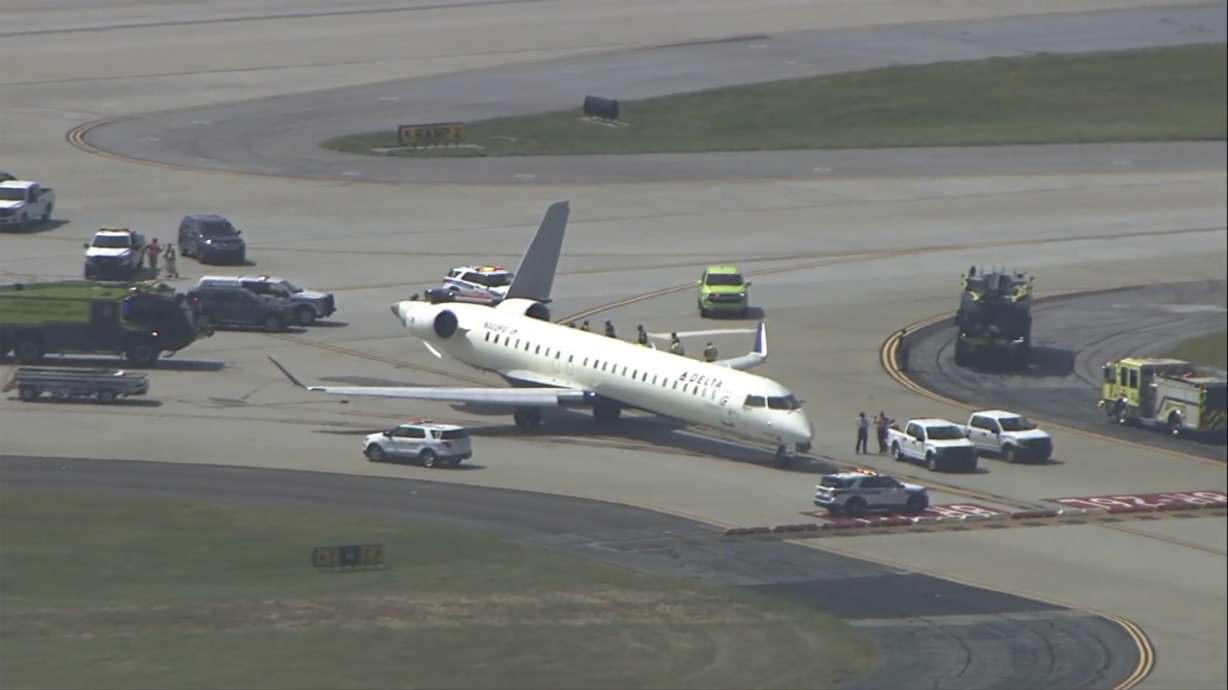 A plane sits damaged at Hartsfield-Jackson Atlanta International Airport after colliding with another plane on a taxiway, Tuesday.