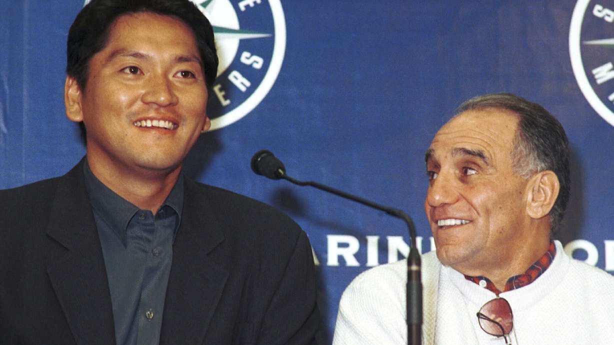 FILE - Yokahama BayStars ace closer Kazuhiro Sasaki, left, and his agent Tony Attanasio, right, address reporters during a press conference at Safeco Field in Seattle, Saturday, Nov. 20, 1999.