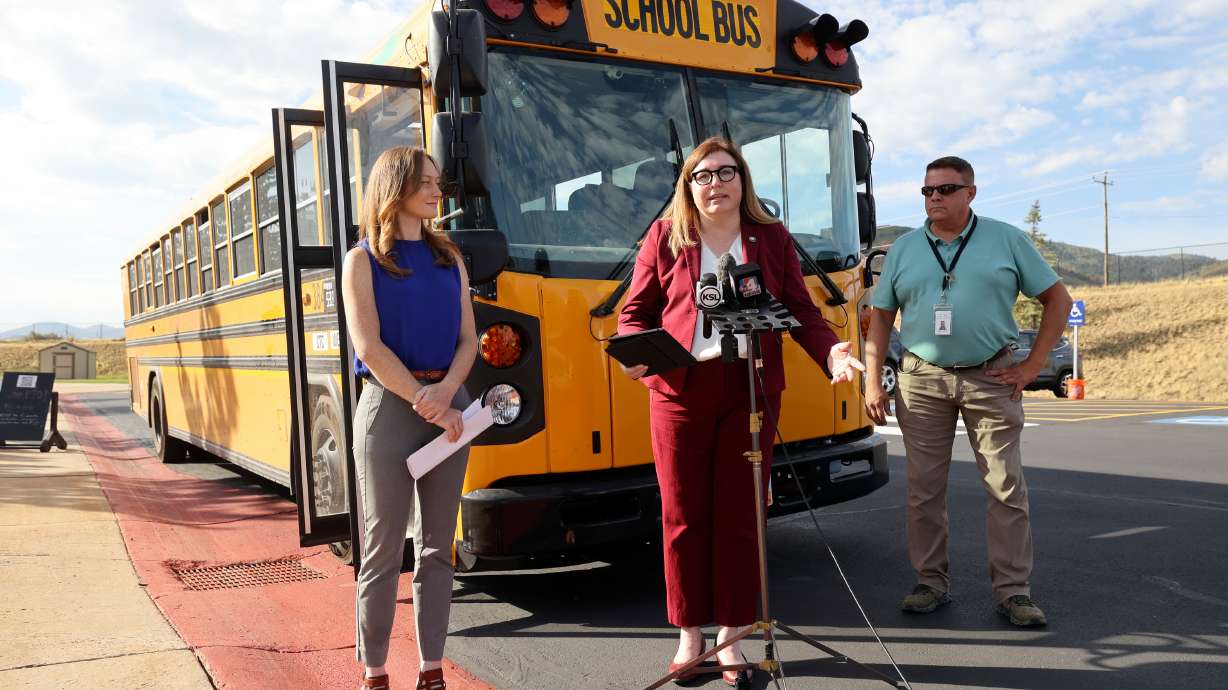 Kelly Watkins, EPA Region 8 chief of staff, Kim Shelley, Utah Department of Environmental Quality executive director, and Mike Tanner, Park City School District COO, announce Tuesday that three Utah school districts will receive $1.49 million to purchase clean school buses.