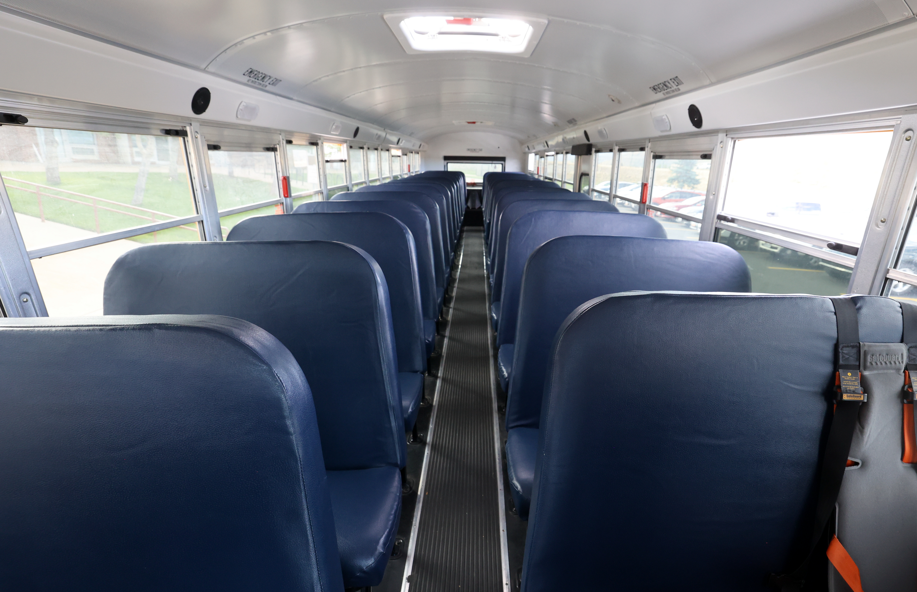 An Eagle Mountain man who police say works as a school bus attendant for special needs children has been charged with five counts of sexual exploitation of a minor.